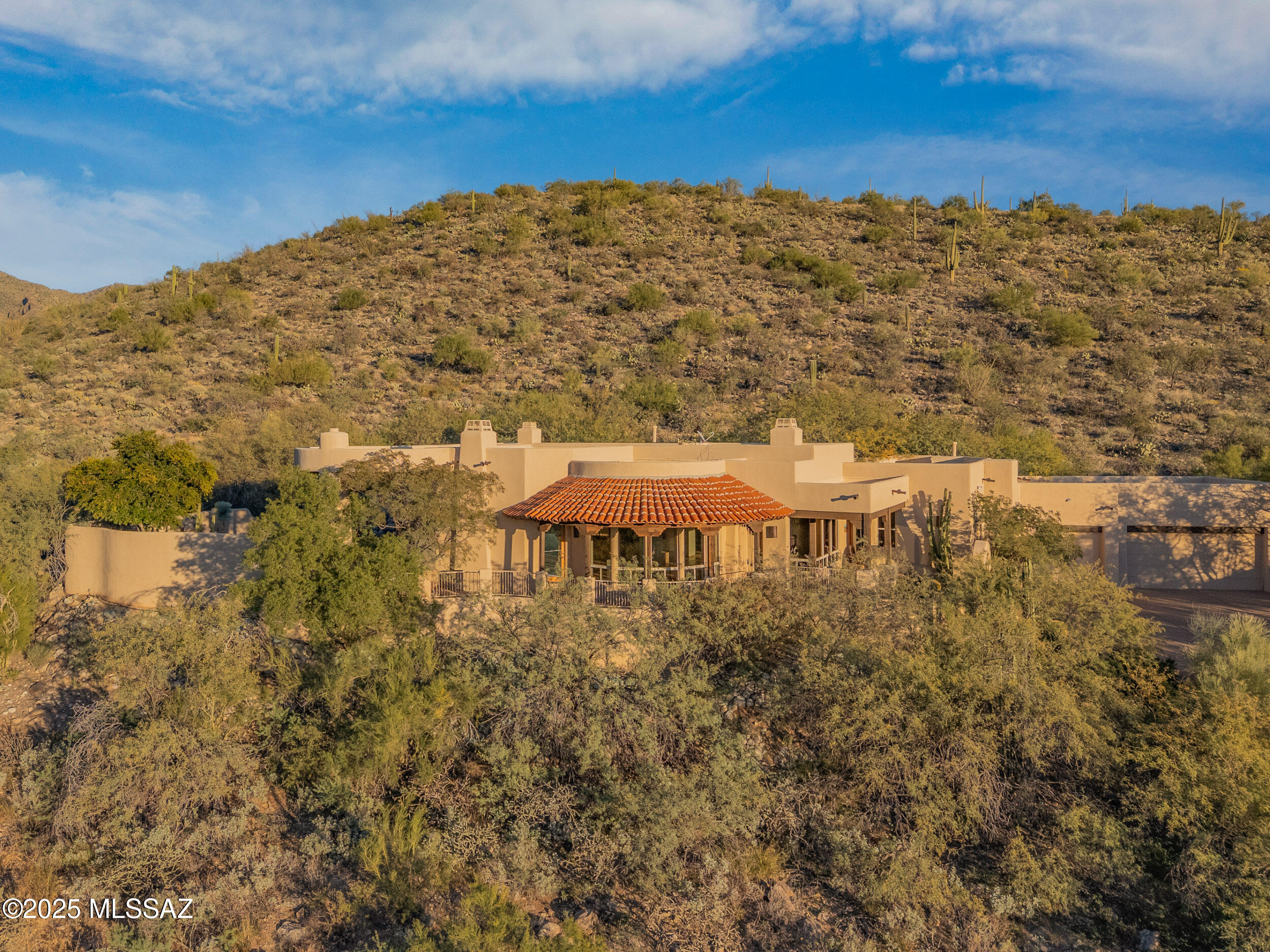 Great hilltop 360 degree view lot with wonderful Santa Fe style home. Gourmet kitchen with granite counter tops, wine cooler, sub-zero fridge and double ovens. Split bedroom plan with spacious master suite. Living areas have high ceilings with classy wood features and beams. Great master suite with fireplace and Jacuzzi tub. Three car garage and workshop. Close mountain views from relaxing pool and spa.

Desert Oasis style pool, spa and backyard area with covered and open patios and decks. Beautifully landscaped and common wildlife sitings.