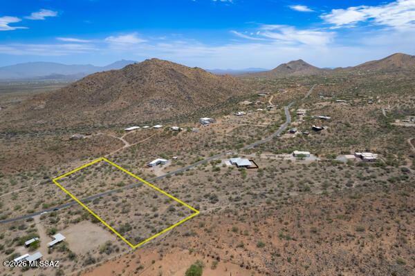 TO BE BUILT on the Vail area where a minimum of 5 acres per residence. Estimated build price includes land ($150,000), ''estimated'' site development ($95,000), and base price of model shown ($505,000) The plan can be modified to fit your specific needs as well as many more plans to choose from including your own custom design.  The site backs off the Coronado National Forest, this property offers spectacular panoramic views of the Santa Rita, Catalina, and Rincon Mountains.  This sought-after setting is ideal for those who value privacy and a close connection to nature.  Area is in the acclaimed Vail school district. No HOA, you'll enjoy the freedom to create the lifestyle you've envisioned.  Utilities are underground. Owner/Agent. Water is available from the Mountain Fagan Water Assoc. The Pike Study Plan offers an open concept kitchen and dining area, a large walk-in pantry, and abundant windows that showcase the surrounding desert mountain vistas, bringing the beauty of the outdoors into your everyday living experience.