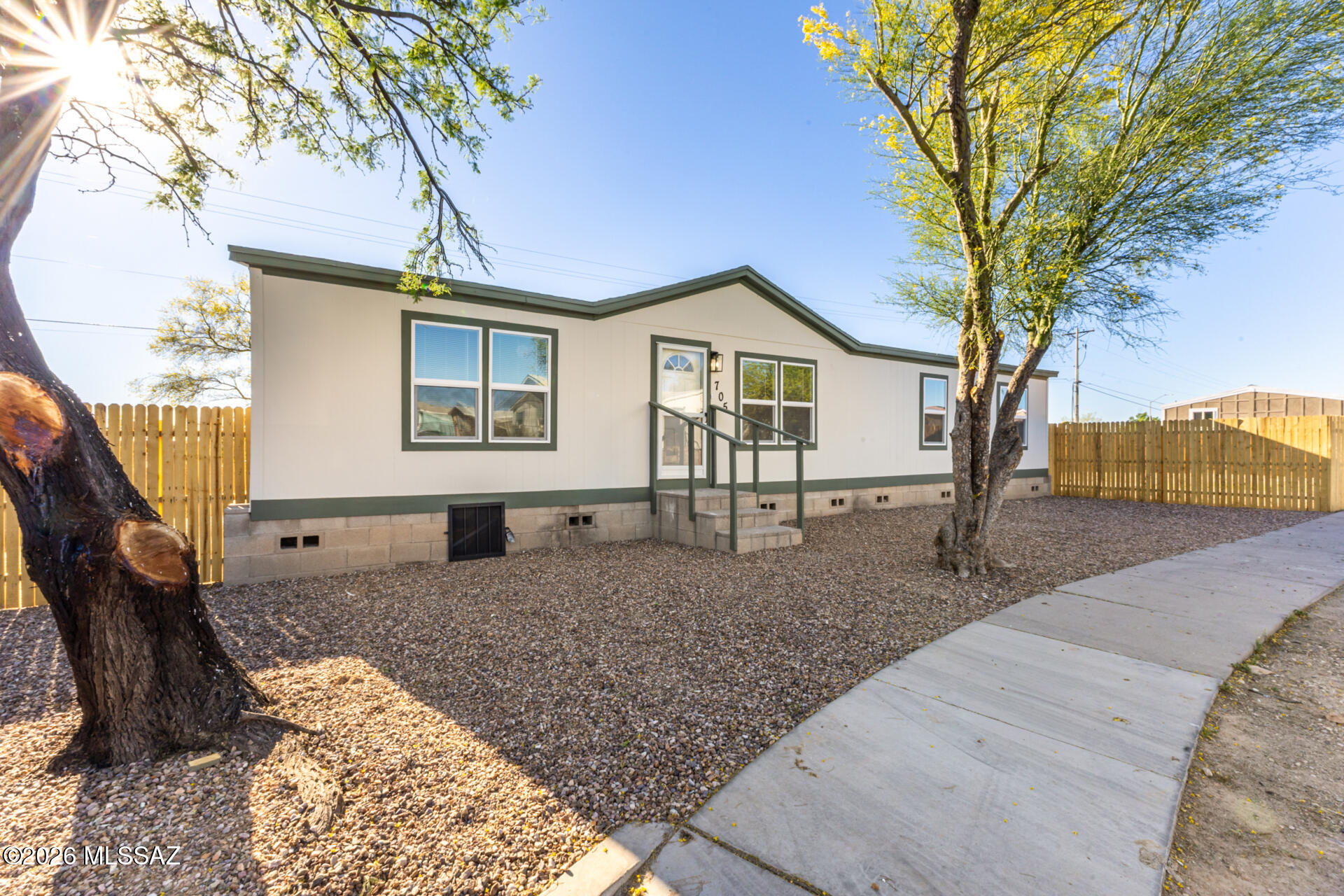 Completely remodeled and move-in ready, this stunning mobile home is the one you've been waiting for! Featuring 4 spacious bedrooms and 2 beautifully updated bathrooms, it offers all the space you need for comfortable living. Major upgrades provide peace of mind, including a brand-new roof and new AC system, ensuring energy efficiency and year-round comfort. The fully renovated kitchen is a true standout, showcasing modern shaker cabinetry, sleek quartz countertops, and built-in appliances--perfect for both casual meals and hosting guests. Outside, enjoy a fenced backyard offering privacy and ample space for outdoor activities and pets.