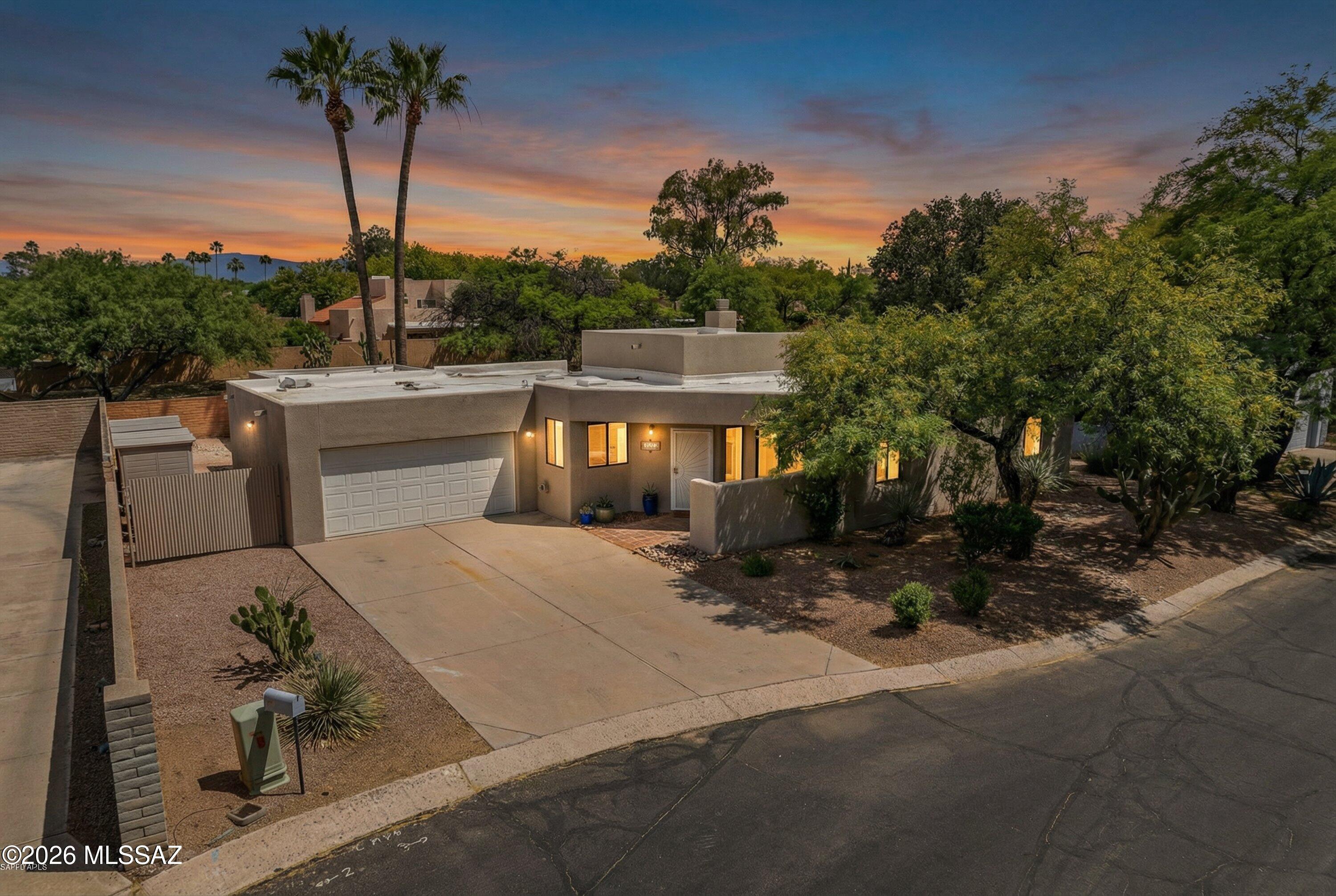Tucked into a prime midtown Tucson location, this inviting home offers 4 bedrooms (with the 4th currently used as a den/office), 2 bathrooms, and a 2-car garage. Completely reimagined with standout updates, the home features 2,109 sq ft of thoughtfully designed living space where the fully remodeled kitchen truly takes center stage, showcasing quality finishes, abundant custom built cabinetry, and a layout that blends both style & function.  Both bathrooms have been beautifully remodeled with clean, updated finishes, while a newer heat pump provides year-round efficiency and comfort, and fresh exterior paint enhances curb appeal. The backyard is designed for true Arizona living with an outdoor kitchen, expansive fire pit area, and a dedicated putting green, along with two storage sheds offering added functionality placed descreetly  in the sideyard. Ideally situated near the Tucson Racquet Club and the scenic Rillito River Park Trail, this home combines modern updates, flexible living space, and an exceptional location close to recreation, walking paths, and everyday conveniences.
