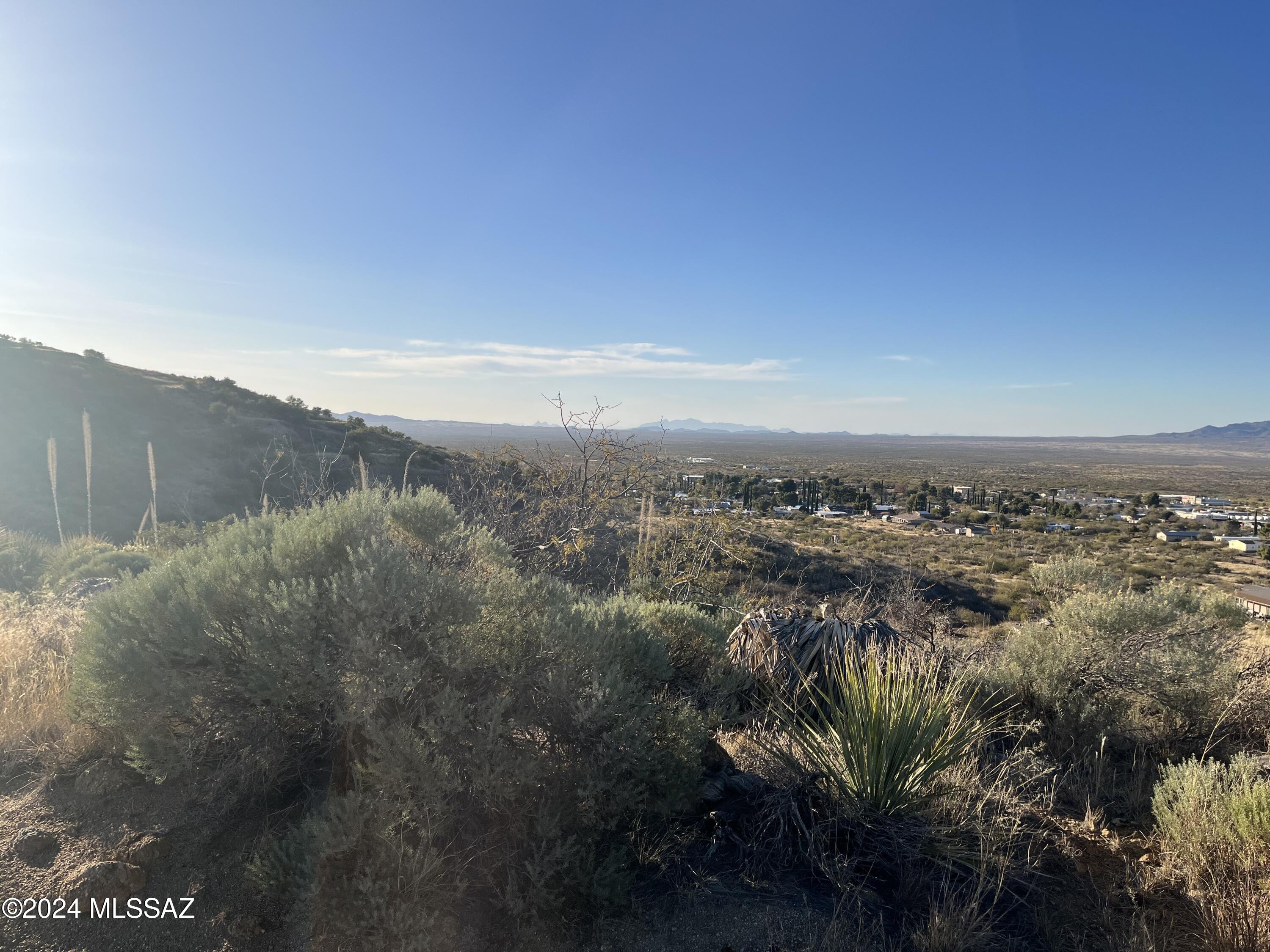 Large hill property with excellent views.  Water line along 3 sides.  Electric at South boundary (Neal street).  Neal Street was just paved.