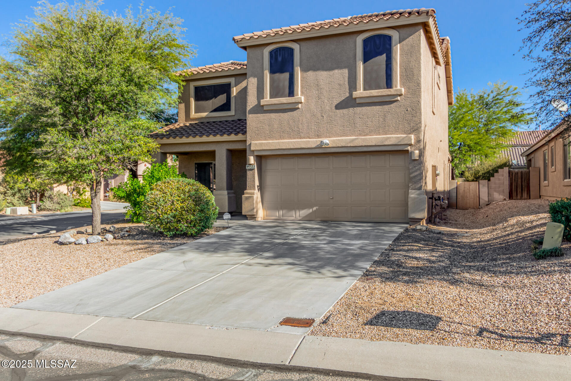 Discover the perfect blend of comfort, style, and functionality in this charming two-story home situated on a desirable corner lot! From the moment you step inside, you'll appreciate the custom paint, abundant natural light, elegant archways, and the beautiful combination of tile and carpet flooring throughout.

The welcoming living room provides the perfect space to greet guests, while the spacious great room is designed for everyday living and effortless entertaining. The well-appointed kitchen features rich maple cabinetry with crown molding, stainless steel appliances, and a dining area with sliding glass doors that lead to the backyard, creating seamless indoor-outdoor living. A convenient powder room is located on the main level, while upstairs you'll find a generously sized loft offering endless possibilities for a home office, media room, play area, or additional living space. The spacious primary suite serves as a private retreat with an ensuite bathroom and a large walk-in closet.

Step outside and enjoy your own backyard oasis. Relax beneath the covered patio surrounded by custom brickwork, gather around the charming exterior fireplace on cool evenings, or enjoy the added character of mature lemon and lime trees. The backyard also includes a chicken coop, providing a unique opportunity for hobby farming or fresh eggs at home.

With its desirable corner-lot location, versatile floor plan, and thoughtful outdoor features, this home offers a wonderful lifestyle opportunity you won't want to miss! Schedule your showing today.