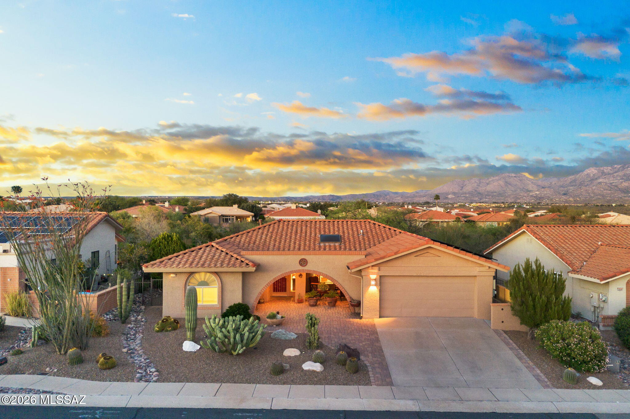 Seller to entertain/counter offers from $450k-$500k. Positioned on a golf course lot in Sun City - Oro Valley, this beautifully updated 2-bedroom, 2-bath home offers 1,668 square feet of easy lock-and-leave living with the ease of single-level design. Thoughtfully updated, the home pairs an open-concept floor plan with a thoughtfully curated interior vision, featuring a light-filled great room with cathedral ceilings and oversized slider, updated kitchen, and a serene primary bath designed for everyday comfort. The result is a home that feels bright, polished and quietly sophisticated. Outside, a paver patio, mountain views, and low-care desert landscaping create an inviting backdrop for everyday living and entertaining. Located in one of Oro Valley's premier active adult communities, residents enjoy access to golf, a recreation center, pool, spa, fitness facilities, tennis courts, and scenic walking and biking paths.