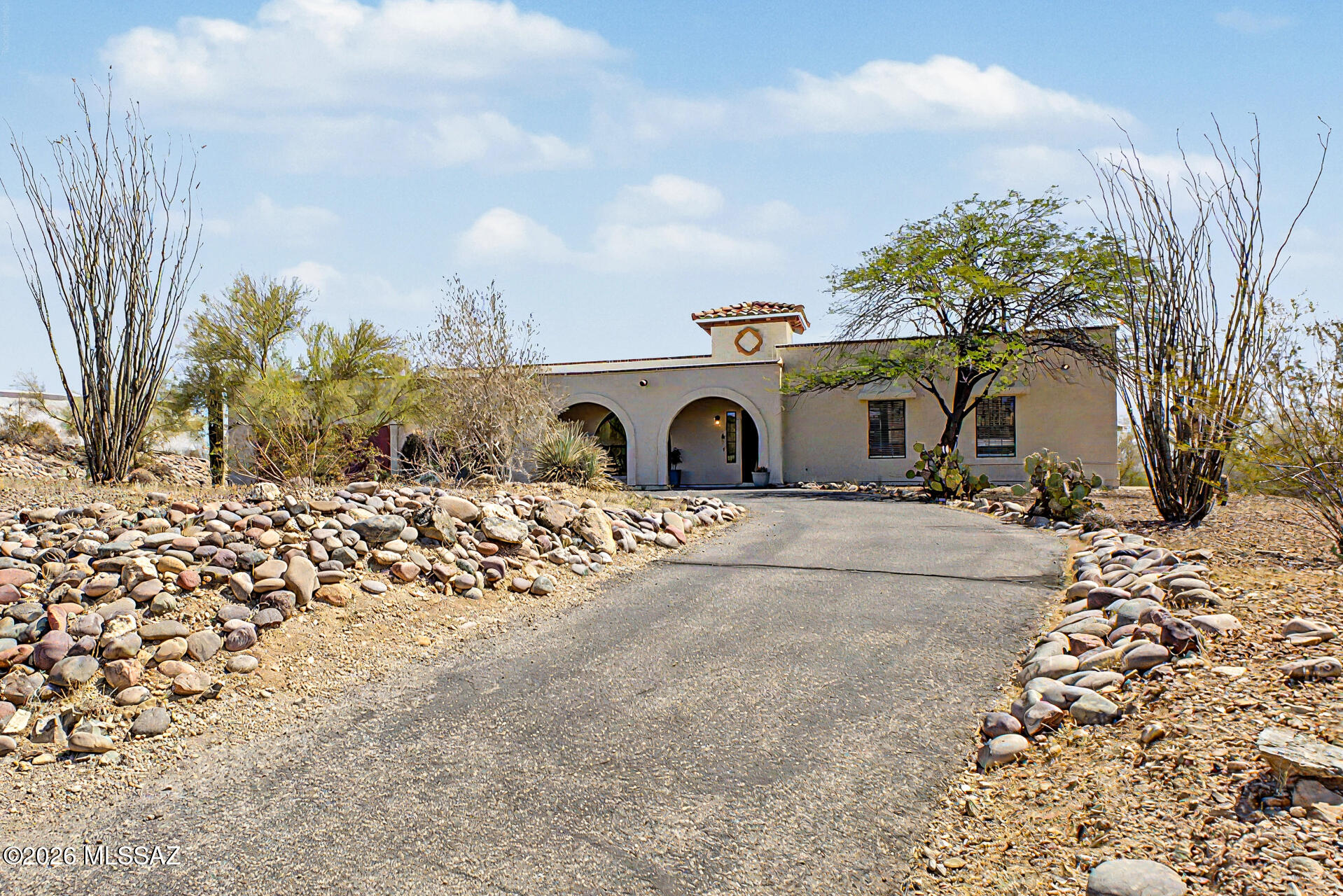 Enjoy desert living with breathtaking mountain views in this beautiful westside rental retreat, set on nearly an acre of natural Sonoran desert landscape. Take in sweeping views of the Catalina, Rincon, Santa Rita, and Tucson Mountains while still being conveniently located just minutes from The Loop, I-10, shopping, dining, hiking, and premier mountain biking trails.

Inside, the home offers an open and airy layout filled with natural light from oversized picture windows that perfectly frame the surrounding desert scenery. Tall ceilings and plank-style vinyl flooring create a warm and inviting atmosphere throughout. The modern kitchen features sleek quartz countertops and opens directly into the spacious family room, complete with a cozy fireplace and sliding glass doors leading to an e an extended covered patio--perfect for relaxing summer afternoons or enjoying peaceful Arizona evenings outdoors.

Small animals are welcome with owner approval. Owners reserve the right to decline pets based on size, breed, and quantity. Non-smoking property.
