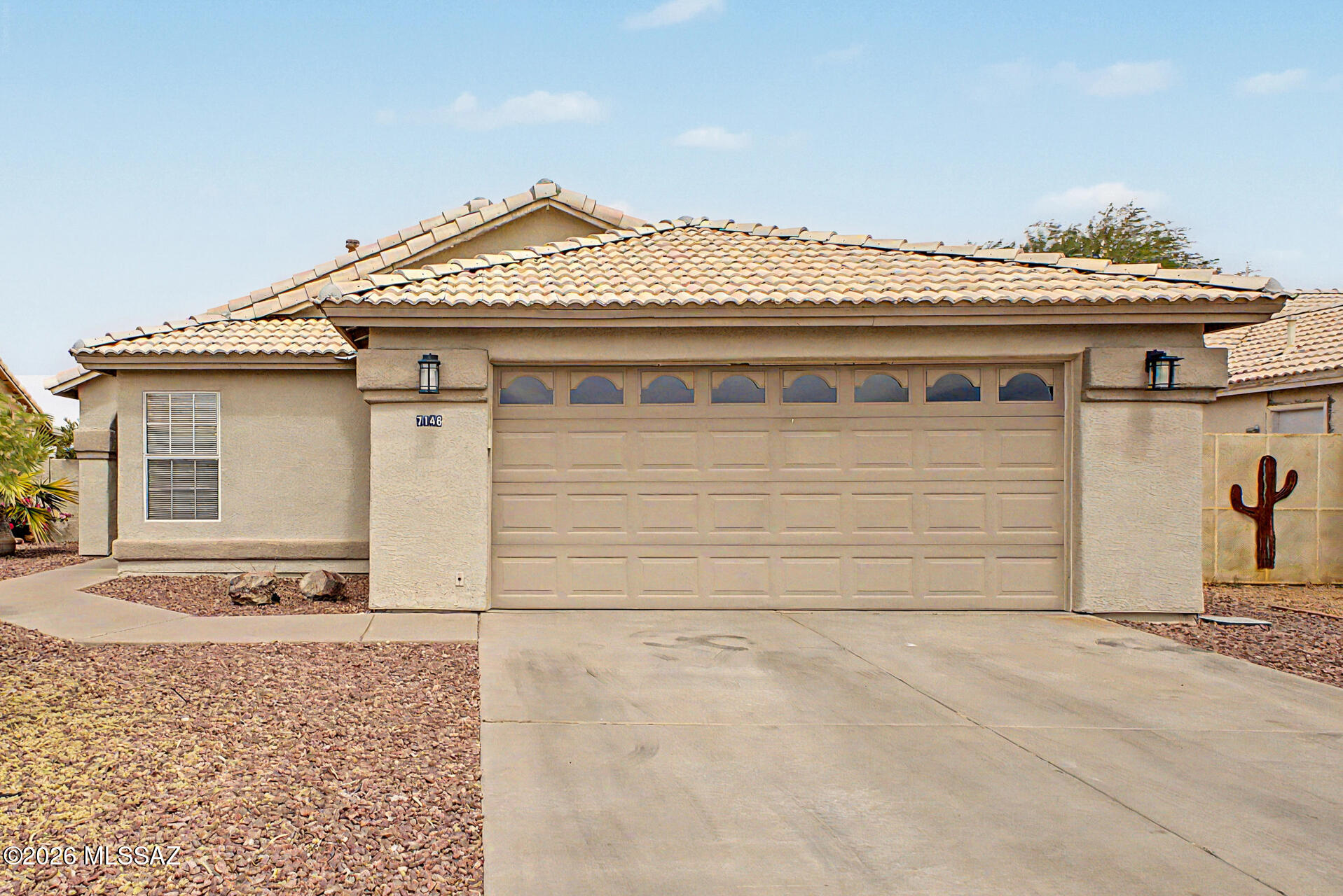 $3,000 in seller concessions to go towards closing costs or an interest rate buy-down.  Desert comfort meets outdoor living in Continental Ranch! This move-in-ready 3BD/2BA home backs to a natural wash with open space for added privacy and scenic views. Located in a low-HOA, community-oriented neighborhood with access to two pools and close to top outdoor amenities, recreation, and city conveniences. 

From the moment you step inside, you'll fall in love with the bright and inviting living spaces, featuring vaulted ceilings and luxury vinyl flooring in main living areas. The kitchen offers granite countertops, stainless steel appliances, ample cabinetry, pantry, and a center island.

Spacious primary suite includes walk-in closet, private backyard access, and ensuite bath with dual vanities and glass-enclosed shower. Secondary bedrooms are well-sized with a shared hall ballroom. 

Laundry room off garage; washer and dryer (2025) included.

Recent updates include roof (2022), water heater (2025), whole-home duct cleaning, and ceiling fans throughout.

Enjoy a private backyard with covered patio, grassy area, and mountain views--perfect for enjoying morning coffee or weekend gatherings.  

Excellent location for those outdoor adventurists: 0.2 mi to The Loop, 0.9 mi to Saguaro National Park trailhead, and approx. 0.5 mi to Quarry Pines Golf Club, a Troon-managed course.This home truly offers the perfect blend of comfort, style, and outdoor enjoyment--don't miss your chance to make it yours.