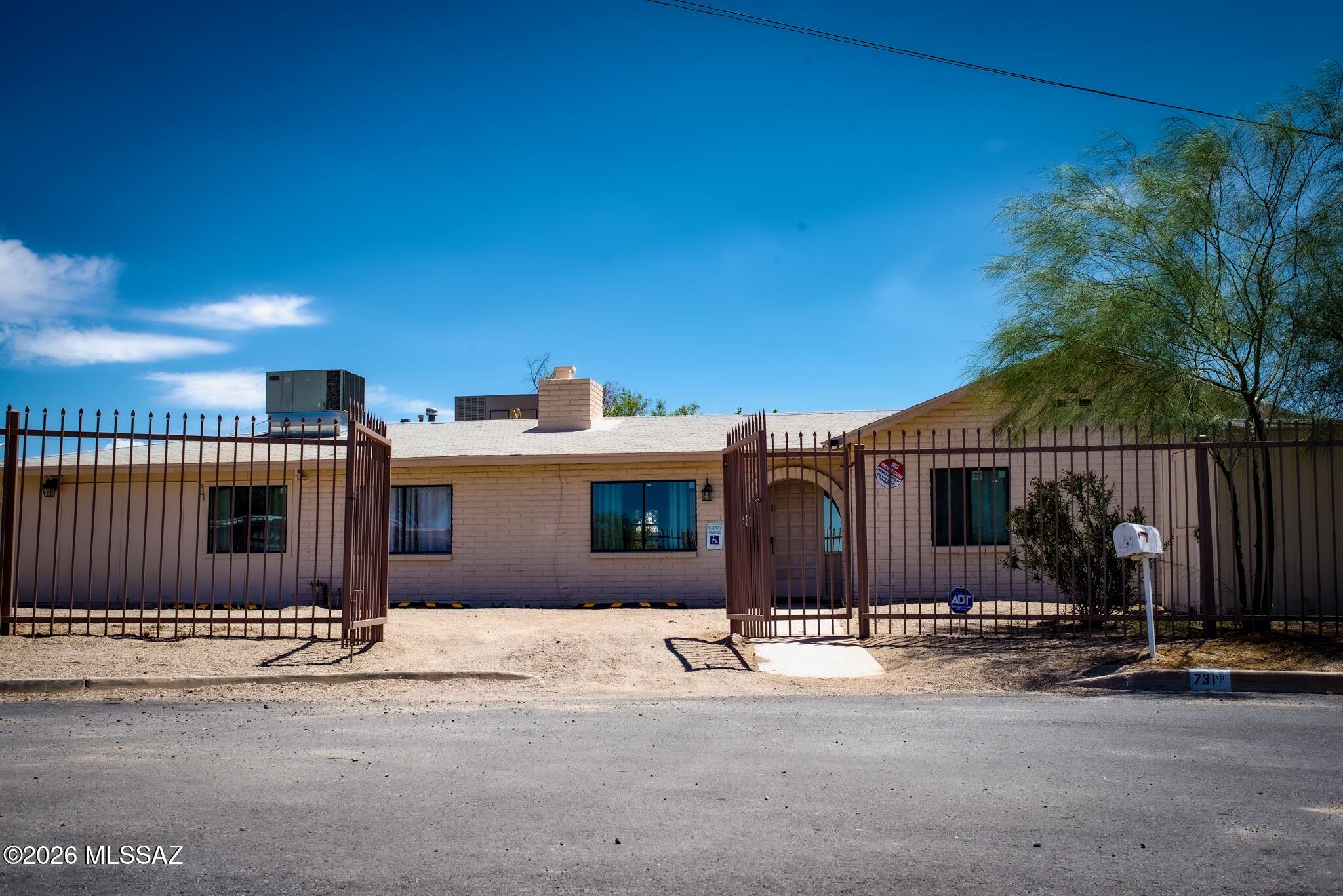 Flexibility you've been looking for in this rare 6-bedroom, 3-bathroom home situated on over a quarter-acre lot in a convenient central Tucson location. With approx. 2,600sf of living space, this home is ideal for a large family, multi-generational living, corporate housing, or other approved residential uses. Inside, you'll find a spacious, updated kitchen featuring beautiful granite countertops, abundant cabinetry, and plenty of room for cooking and gathering. Durable ceramic tile flooring throughout the home provides easy maintenance, while a newer 50-gallon water heater offers added convenience for larger households. The versatile floor plan provides generous bedrooms and multiple living spaces to accommodate a variety of lifestyles. One of the owners is a licensed real estate broker