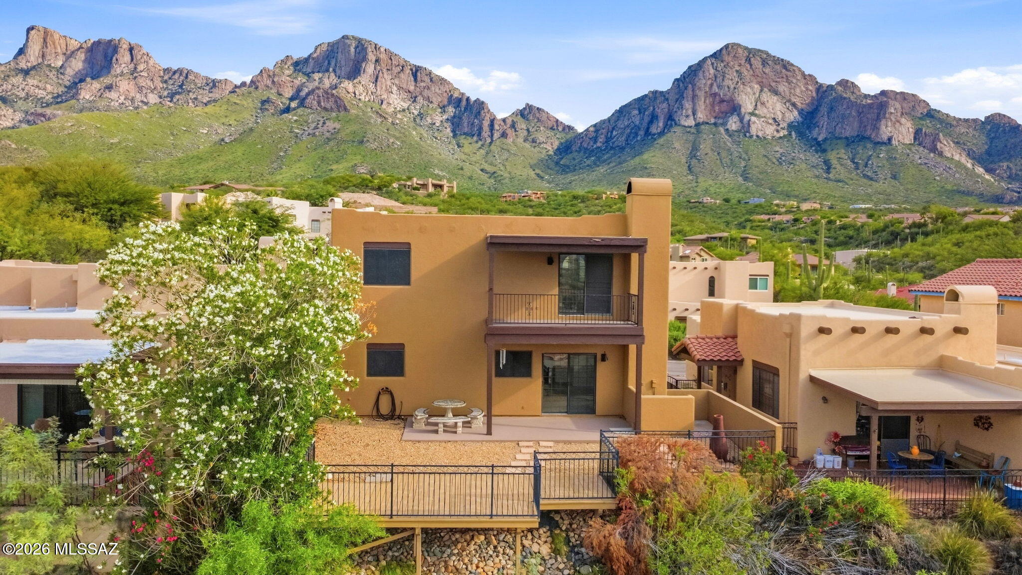SHOW-STOPPING VIEWS! Welcome to this beautifully maintained 3-bedroom, 2.5-bath, two-story home in the desirable guard-gated Deer Run community at La Reserve. Perched above the desert floor, it captures spectacular mountain views and stunning Oro Valley city lights. Move-in ready and thoughtfully updated with new quartz kitchen countertops, stainless steel appliances, updated lighting, epoxy-coated garage flooring, and more. Enjoy breathtaking Arizona sunsets from your private retreat, relax by the community pool, or explore nearby shopping, dining, golf, and everyday conveniences. Offering comfort, privacy, and the beauty of desert living, this exceptional home is one you won't want to miss. Come see this Deer Run gem!