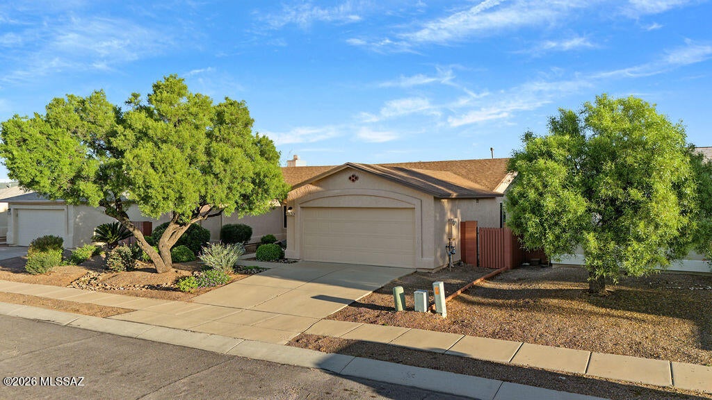 Very clean updated 4 bedroom, 2 bath home.  Split bedroom plan. Separate  living and family rooms.  Well maintained and updated by owner.  New kitchen 2017 with Dekton countertops and Natural Slate GE appliances.  Bathrooms remodeled in 2024.  Master has roll in shower.  Dual sinks with raised cabinets.  Large walk in closet.  New roof 2020, new 16 Seer AC/Furnace 2020, new windows and patio door 2015, new hot water heater 2020, new Gas fireplace 2025, Smart thermostat.  Wood blinds.  Low care landscaping with auto drip system.  Artificial turf in backyard.