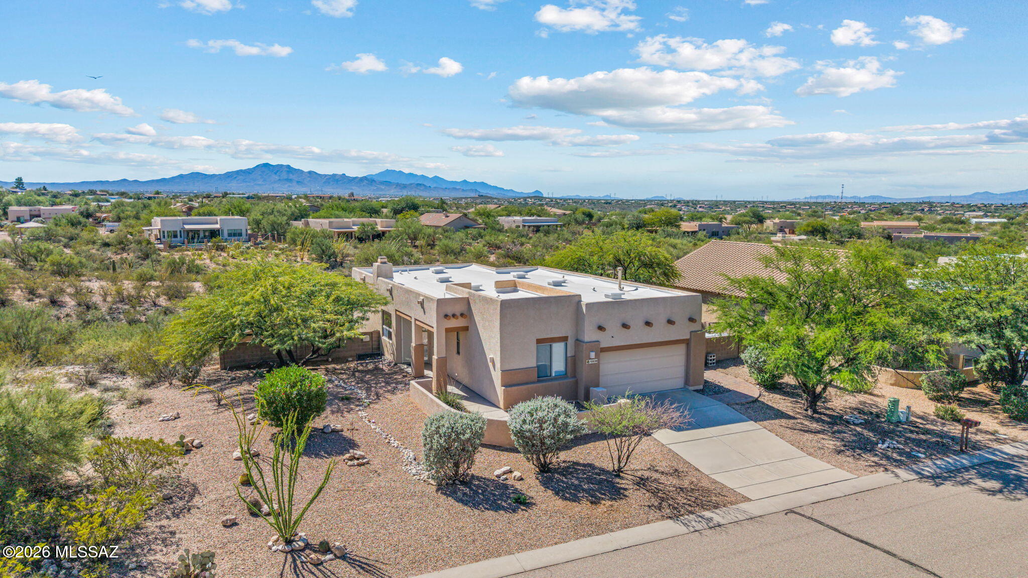 New listing in the Estates at Cienega Creek Preserve - An established semi-custom home community set in the scenic Sonoran Desert in Vail AZ. Santa Fe style, 3 Bdrm on premium .32 acre lot, on a cul-de-sac street. Open space between neighborhoods preserves the lush natural desert. Amazing views from the backyard and patio! Well built with high ceilings, wood burning fireplace, good insulation, and ceiling fans. Tiled living areas and newer carpeting in the bedrooms. Comfortable Great Rm / split bedroom floorplan. Stainless appliances include refrigerator, microwave, dishwasher and new electric range. New Samsung washer & dryer. Pavered patio & walkways. Close to grocery, gas, and restaurants. Nearby hiking & biking trails. Top rated Vail Schools. Easy access to I-10. Ready to move-in!