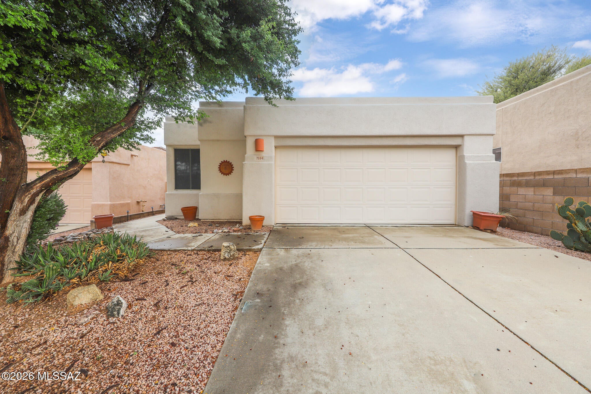 Beautiful 3BR/2BA home in a gated community in sought-after NE Tucson! Split floor plan features high ceilings, decorator colors, ceiling fans & cozy gas fireplace. Eat-in kitchen offers stainless steel appliances & breakfast bar open to dining & living areas. Primary suite boasts walk-in closet, dual vanities & walk-in shower. Washer/dryer included. Situated on a cul-de-sac lot with NE orientation, mountain views, covered patio & private rear yard with lush landscaping. 2-car garage with storage. Enjoy 3 community pools, one conveniently located nearby in the cul-de-sac! Owner/HOA maintains front landscaping. Convenient to restaurants, shopping, Sabino Canyon & Udall Park. Enjoy comfort, privacy & resort-style living!
