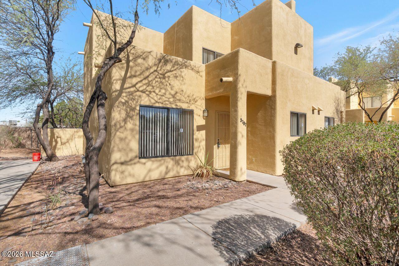 Excellent opportunity! This spacious two-story, 3-bedroom condo is ideally situated in a centrally located, gated community with an intimate feel, near shopping, restaurants, and bus lines. The kitchen opens directly to the dining area, creating a functional and inviting layout. Additional features include dual sinks in both bathrooms, 9-foot ceilings, new carpet, two covered parking spaces, and a convenient downstairs bedroom and bath. The HOA adds exceptional value by covering the community gate, all exterior maintenance including roof, water, sewer, trash, structural insurance, and common area upkeep.