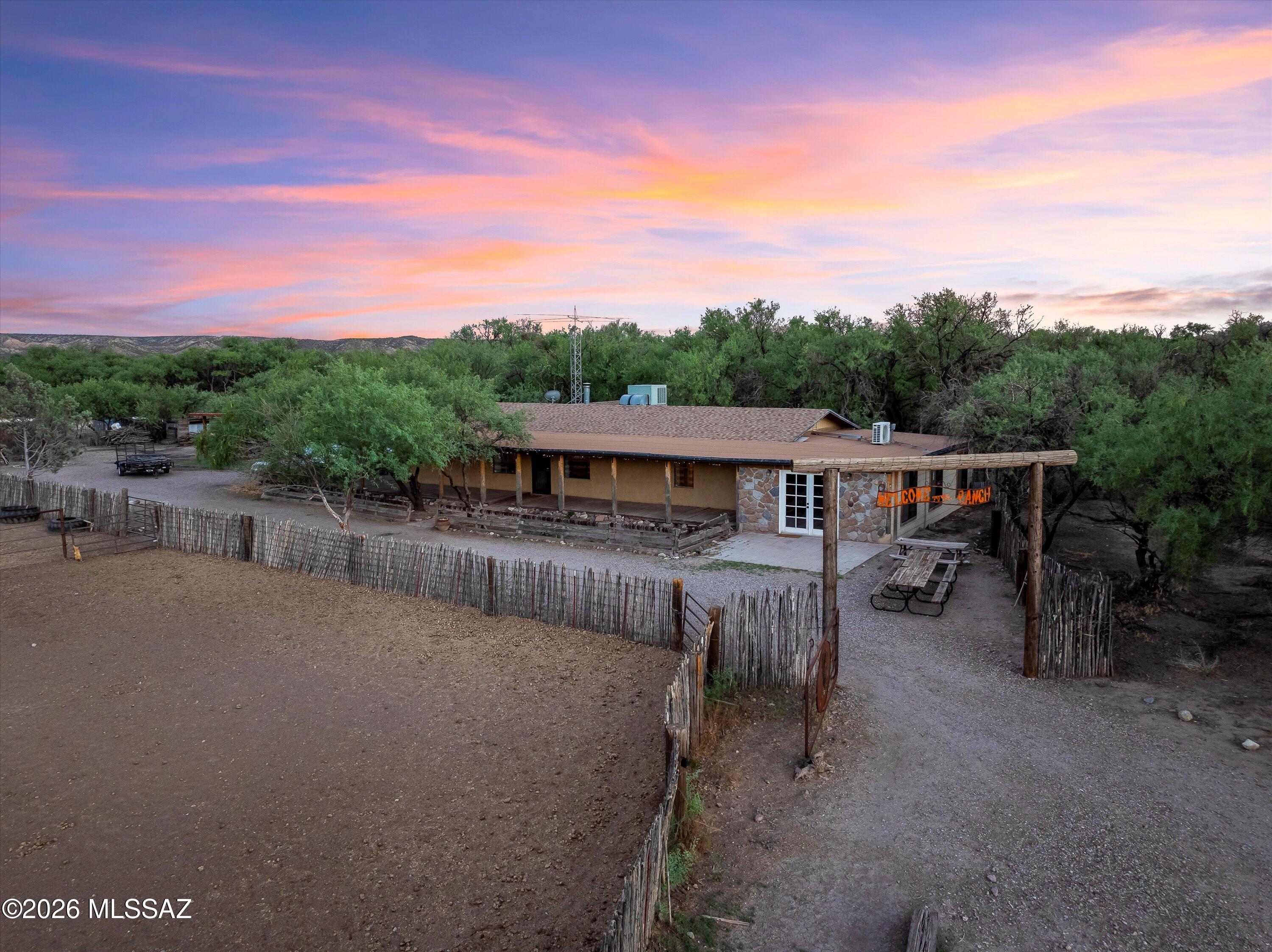 Escape to wide-open spaces and peaceful living on this one-of-a-kind 9.96-acre horse property. This charming 2-bedroom, 2-bath straw bale home offers natural insulation, rustic character, and authentic Mexican tile throughout, creating a warm, inviting ranch-style feel.

The property is thoughtfully set up for equestrian and homestead living, featuring an arena, pens, turnouts, hitching posts, and a huge tack room. A separate bunk house and bonus room off the main home provide flexible space for guests, hobbies, or a home office.

Enjoy self-sufficient country living with a private well and whole-home generator, plus the added advantage of commercial zoning for future business or income-producing opportunities. With access to state land for trail riding and outdoor adventures