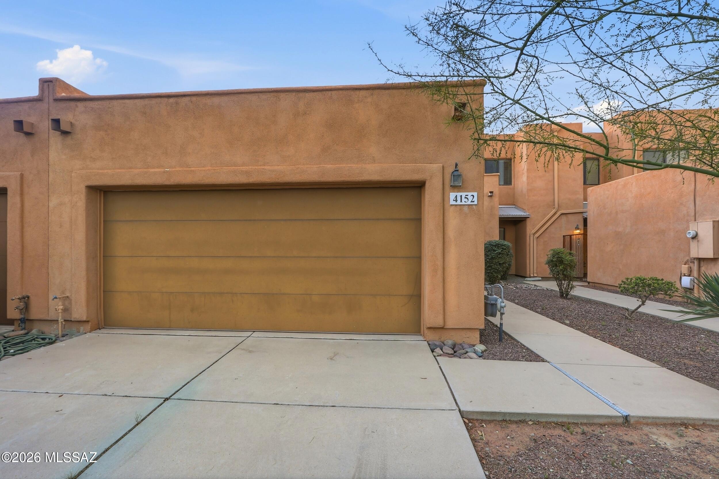 This lovely TH feautures beautiful 18'' ceramic tile in living room & all wet areas, upgraded maple cabs, blinds throughout, alarm installed, fan prewires, enclosed backyard backing up to common area (no one behind), 2-car garage, post-tension, & more. Walking distance to LA Fitness, Trader Joe's, and Sprouts & the Rillito river wash, and 3 miles from UMC/UA down Mountain Ave by car or the bike path. No shared walls with adjacent units, these are 0-lot line units, each has their own end walls.