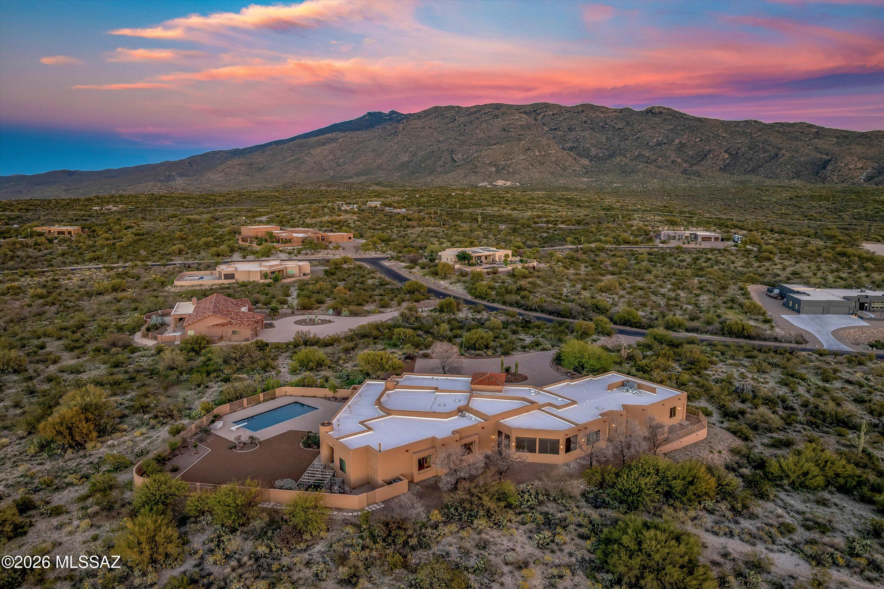 Sophisticated Luxury Living with Panoramic Views & Multi-Generational Suite.
Experience the pinnacle of desert elegance in this expansive Custom Built 5 bed plus den, 6-bath masterpiece. Designed for those who demand both style and substance, this home welcomes you with a dedicated executive office and a private library featuring a ''hidden cove''--the ultimate sanctuary for quiet reflection.
The heart of the home is built for connection, but the true rarity is the multi-purpose guest suite. Perfectly suited as a mother-in-law quarter, this independent living space offers comfort and privacy under one roof. For the automotive enthusiast or fitness buff, the 3-car garage includes an expansive bonus area currently used as a home gym, which can easily be converted into a 4th car garage The heart of the home is built for connection, but the true rarity is the multi-purpose guest suite. Perfectly suited as a mother-in-law quarter, this independent living space offers comfort and privacy under one roof. For the automotive enthusiast or fitness buff, the 3-car garage includes an expansive bonus area currently used as a home gym, which can easily be converted into a 4th car garage.

Step outside into your private backyard oasis. Frame-worthy mountain and city light views provide the backdrop for an entertainer's dream, featuring an extended covered patio, sparkling pool, and built-in gas BBQ. With a dedicated dog run for your furry companions and lush rose bushes adding a touch of classic beauty, this home truly has it all.