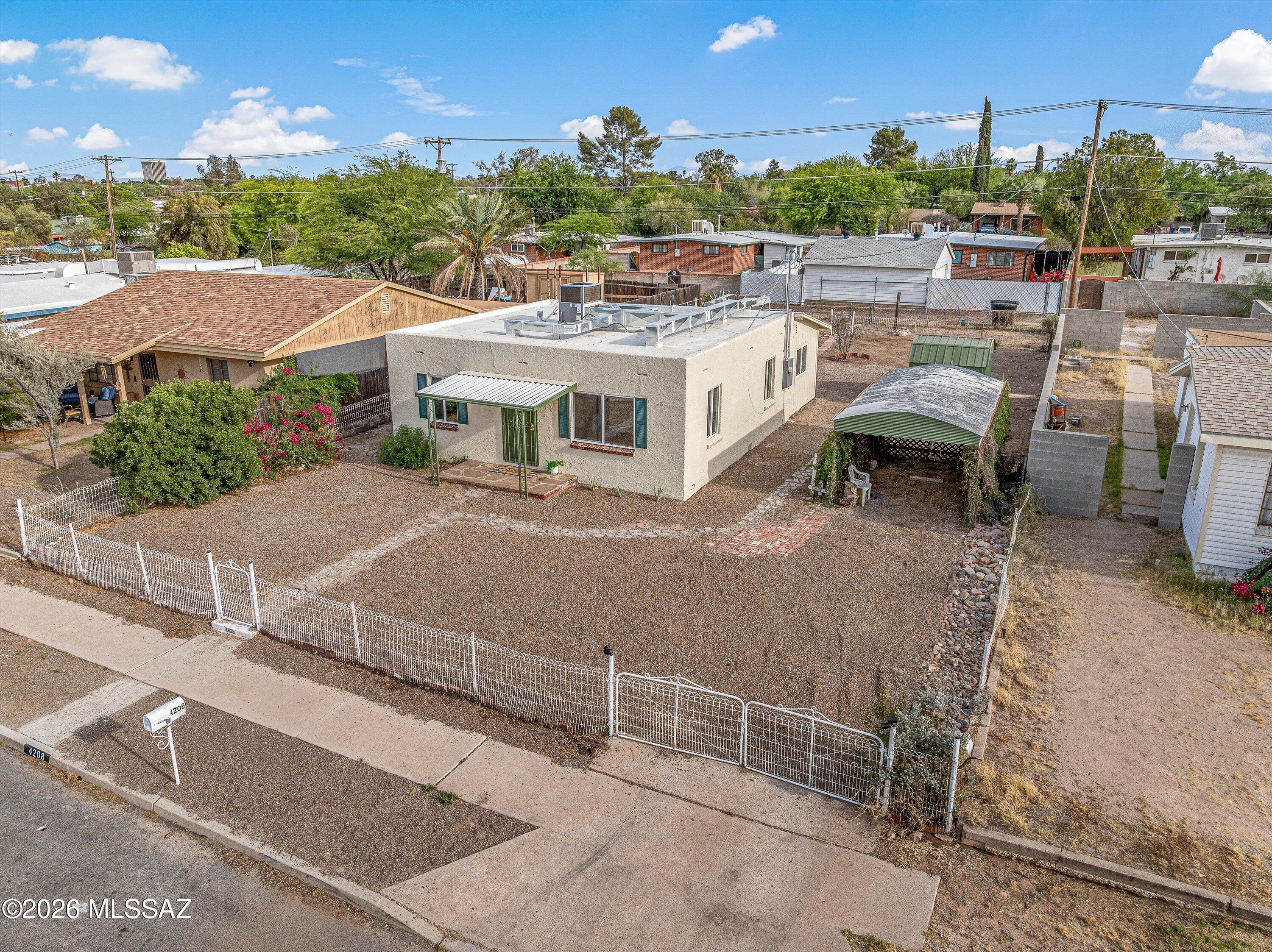 Fully renovated and move-in ready, this centrally located Tucson home blends modern upgrades with unique character. Improvements include a brand-new HVAC system, updated electrical, tankless water heater, dual-pane windows, sliding glass door, new flooring, fresh interior paint, and a remodeled bathroom with custom tile shower. The redesigned kitchen features new cabinets, new quartz countertops, new sink, and stainless steel appliances. Exterior upgrades include stucco repair, full exterior paint, new gravel landscaping for added curb appeal. Attached utility/laundry room offers extra storage. Spacious backyard with endless possibilities plus a rare underground bunker. No HOA. Conveniently located near the University of Arizona, downtown, shopping, and dining.