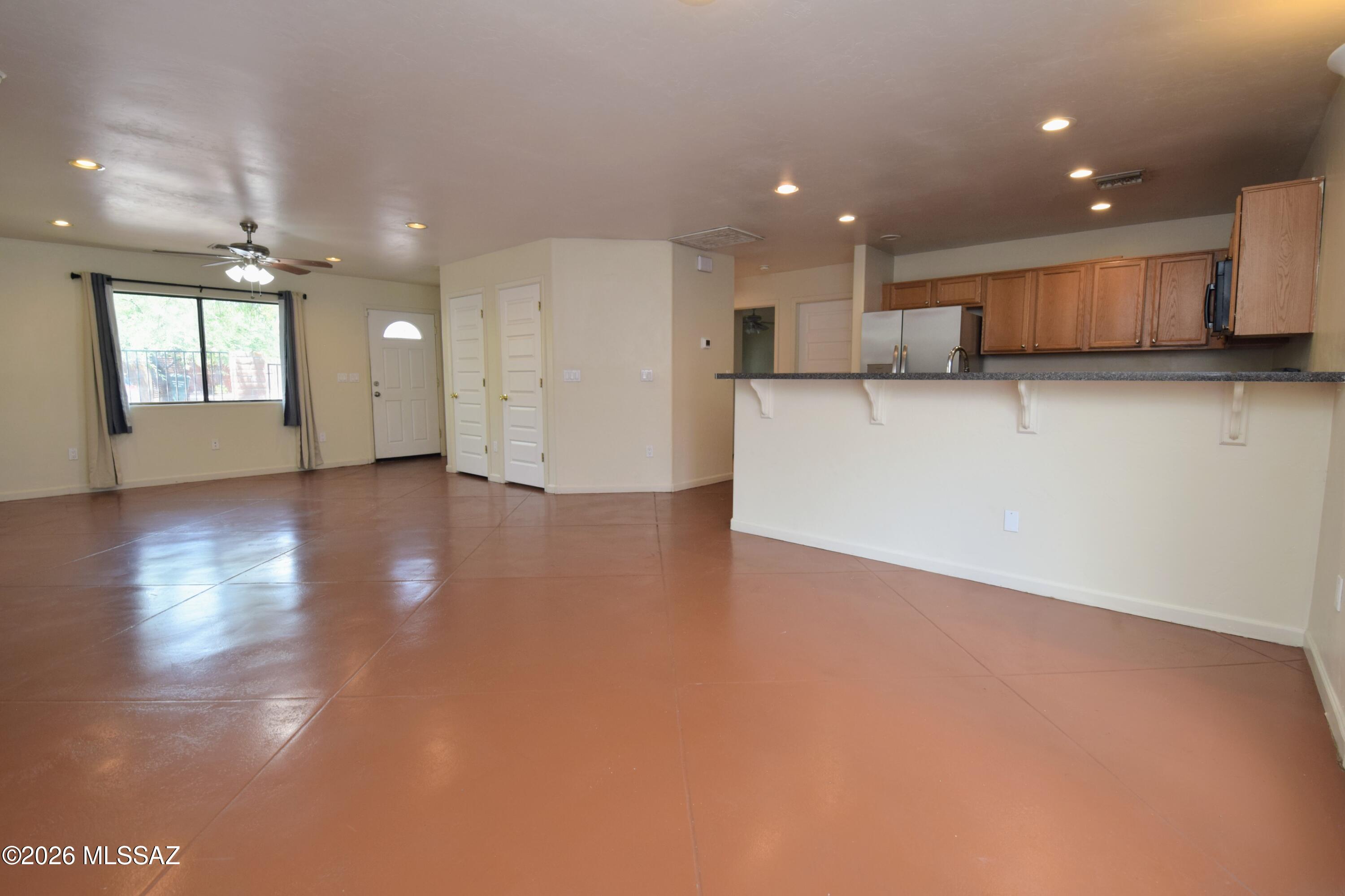 Modern 4 Bed 5 Bath Near UofA - Private Baths & Off-Street Parking

Now pre-leasing for August 2026, this modern 1,920-square-foot home offers an unbeatable location within easy walking distance to the University of Arizona. Designed for premium student or group living, the interior features stamped and newly painted concrete floors throughout an expansive floor plan where each of the four large, identical bedrooms boasts its own private en-suite bathroom and ceiling fan. The well-appointed kitchen is equipped with a long breakfast bar, side-by-side refrigerator, stove, and dishwasher, making it the perfect hub for socializing and meal prep. Convenience is prioritized with central air conditioning and heating full-sized indoor laundry, and rooms pre-wired for high-speed cable and internet. Outside, you will find a landscaped front and back yard along with off-street parking for three vehicles and additional street parking that requires no permit. Rent includes water, sewer, and trash services, providing a streamlined living experience in a vibrant Tucson neighborhood. This is a non-smoking property where small dogs are considered, though no cats are permitted. Water/Sewer/Trash/Recycle included in rent.