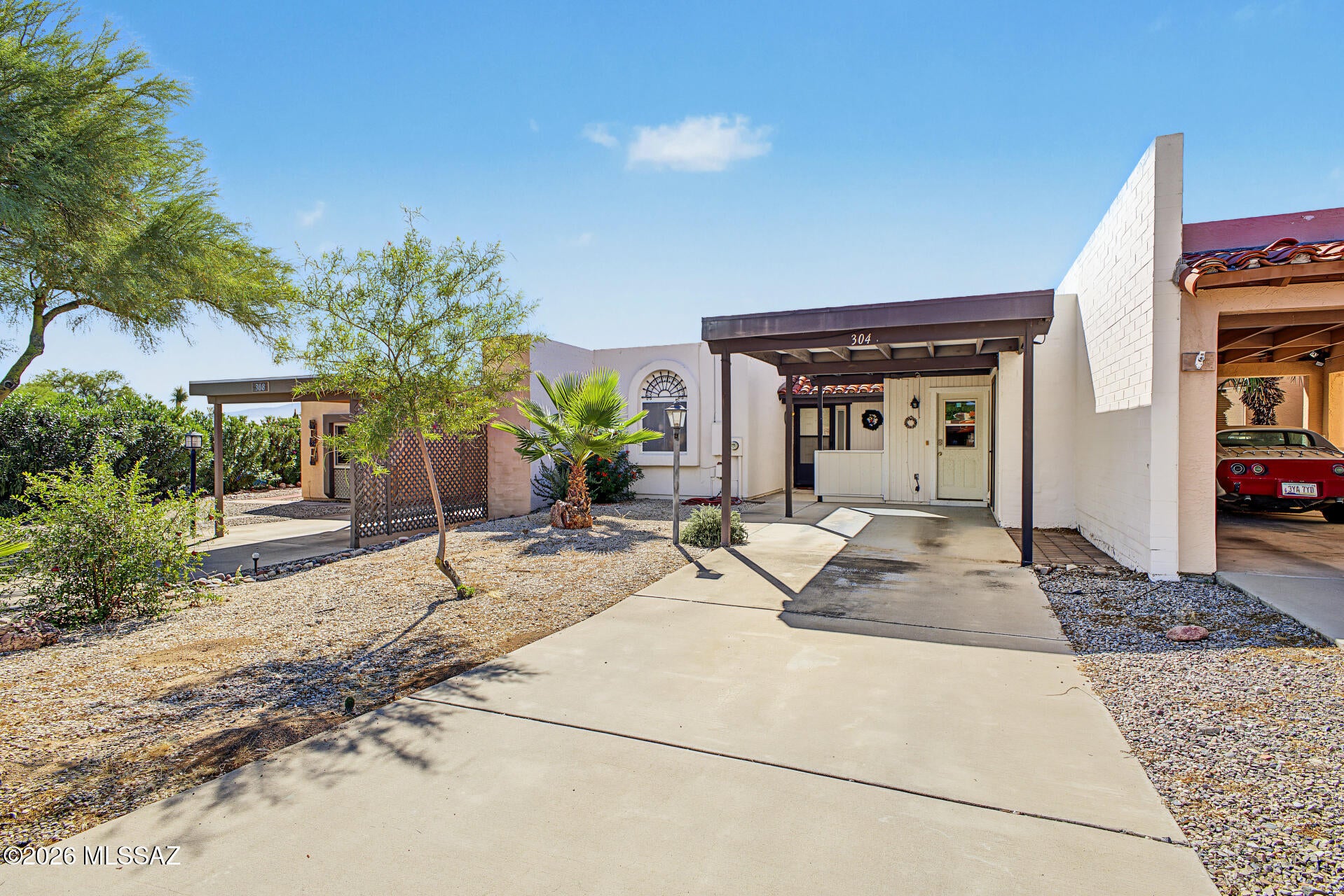 Enjoy comfort, privacy and Mountain views in this 2-bedroom, 2 bath townhome located in the quiet community of Los Palomas II. The living room and covered back patio overlook the mountains and the Whipple Observatory, which sparkles on clear nights like a ''diamond in the sky.'' A unique stained-glass feature adds charm to the peaceful patio retreat.
Inside, updated ceramic tile flows throughout the living spaces and bathrooms, while surround sound enhances the living room experience. Additional highlights include a workshop in the rear, front storage space, and a setting that offers both tranquility and scenic beauty. Add your own personal touches to make this home yours.