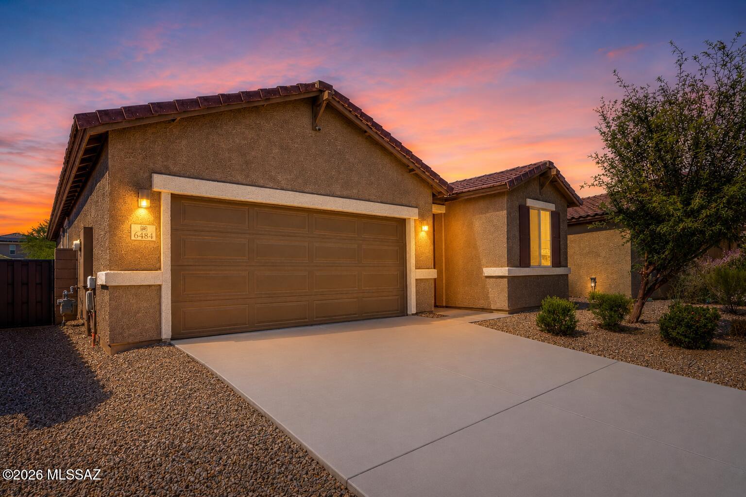Welcome home to your 3 bedroom + office 2022-built single-story retreat located in the award winning Vail School District, with an assumable VA loan. The heart of this home is an inviting kitchen with granite countertops, gas-range, walk-in pantry, and breakfast nook overlooking a spacious great room. The home features three bedrooms, including a beautiful primary suite with oversized walk-in closet. Upgraded tile and countertops throughout the living and bathroom areas. Dedicated laundry room with both gas and electric connections. Ceiling fans throughout, and 9' ceilings. Located in the highly desirable La Estancia community where you will love the great selection of schools available within the sought after Vail School District. La Estancia has direct access to 'The Loop', an interconnected system of more than 130 miles of paved pathways and bike lanes, two community pools, basketball court, pickleball courts, and more than eight beautiful parks. La Estancia is within close proximity to many major employers, including Davis-Monthan AFB, Tucson International Airport, UA Tech Park, Raytheon and Amazon. Come see your gorgeous new home today!