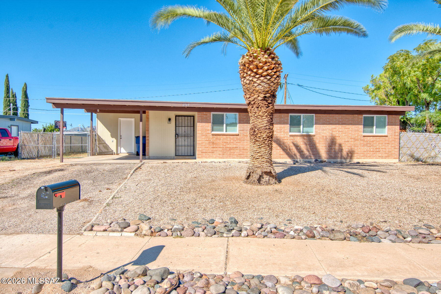 Beautifully updated east side home on a large lot with nice sized back patio and north facing backyard with mountain views.  Mature trees and easy care landscaping. Inside is where the true magic happens with new windows, new flooring, updated bathrooms with new fixtures and new closet doors. Fresh paint, new AC, and water heater, upgraded electrical panel, new lighting and ceiling fans, new kitchen appliances and freshly coated roof. Super cute and move in ready. This home is an absolute gem of a property with 4 bedrooms and 2  beautiful bathrooms. Plenty of parking and a large laundry room with extra storage.