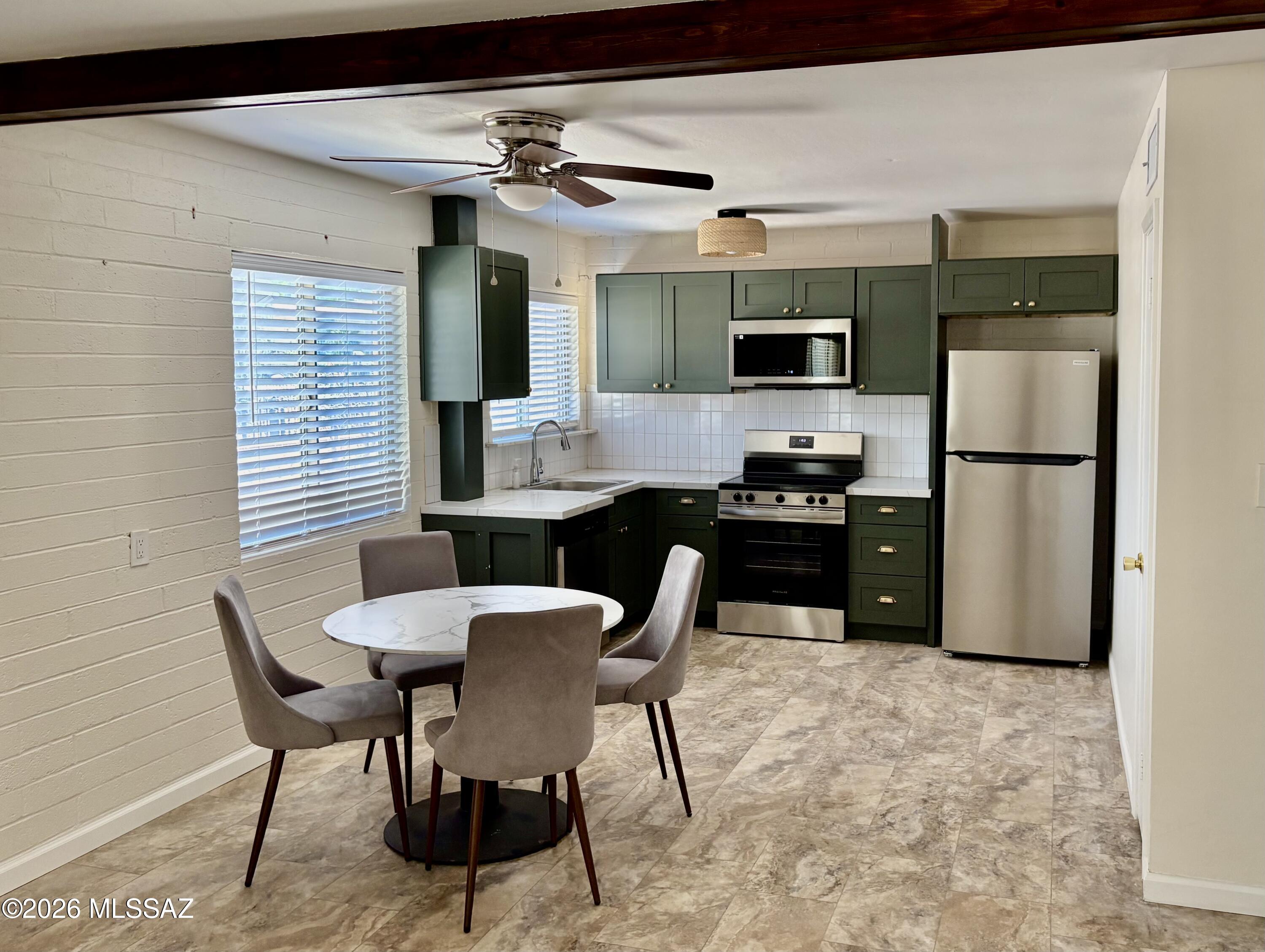 Tastefully updated and centrally located, this inviting 2-bedroom, 2 bath ground level condo offers comfort and convenience. The home features a beautifully renovated kitchen and refreshed bathrooms providing a modern move in ready fee. Enjoy a peaceful setting within a quiet community just minutes from shopping dining and everyday amenities. HOA covers water, gas, sewer, trash exterior building maintenance, and access to the community pool. On site laundry facilities add convenience and rental opportunities are permitted making this an excellent option for both homeowners and investors.