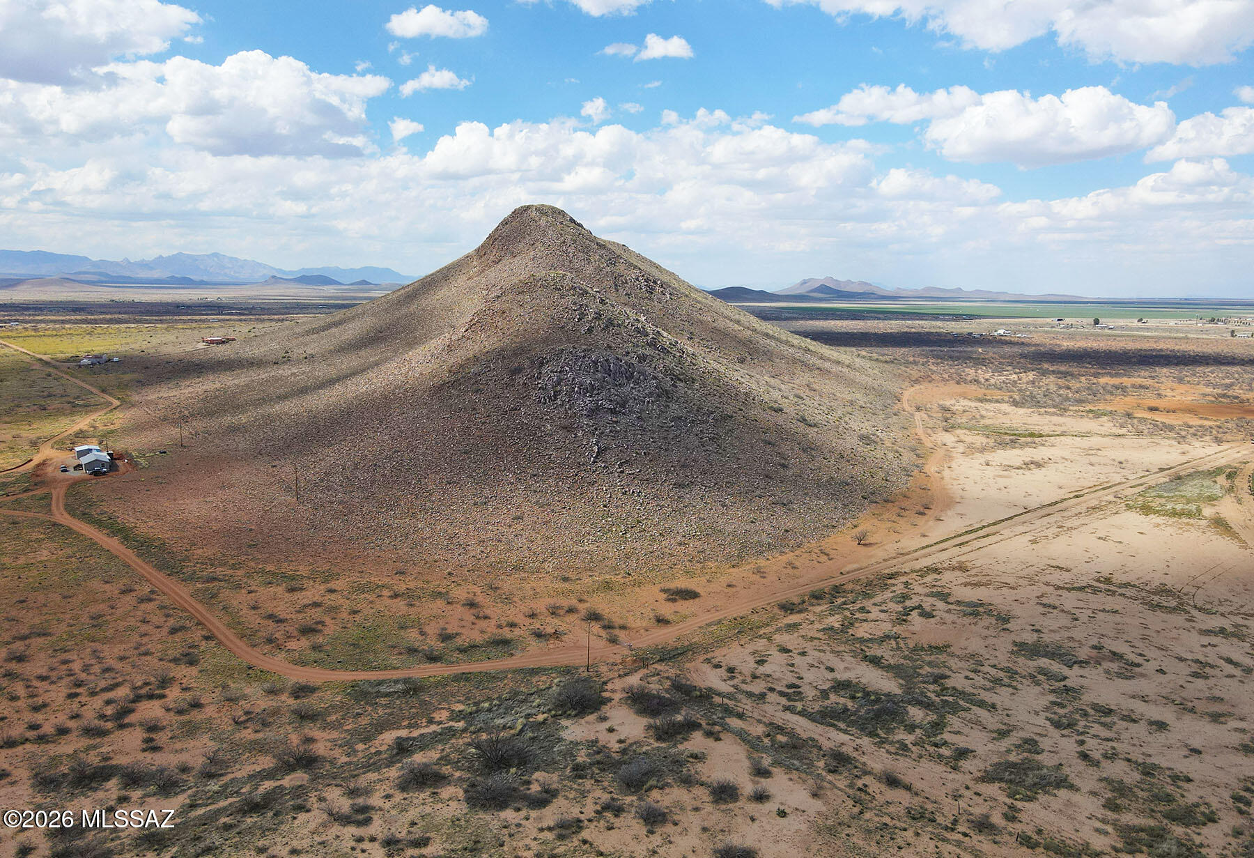 A rare opportunity to own your own hilltop in southeastern Arizona. This 39.3-acre parcel sits at the south end of Ash Creek Ridge, featuring dramatic geology and varied topography that sets it apart from flat desert lots. Climb up and elevate above the landscape for sweeping views of the Sulphur Springs Valley, framed by the Chiricahua Mountains to the east. Zoned RU-4 in Cochise County with power poles already to the lot. The property is partially fenced with easy road access just minutes from paved Highway 181. Wrap-around access from two sides and a gate at the SE corner. Surrounded by rolling hills in the White Tail Ridge subdivision, this acreage offers genuine quiet and seclusion. A highly unique option for a private home site, recreational retreat, or long-term land investment.