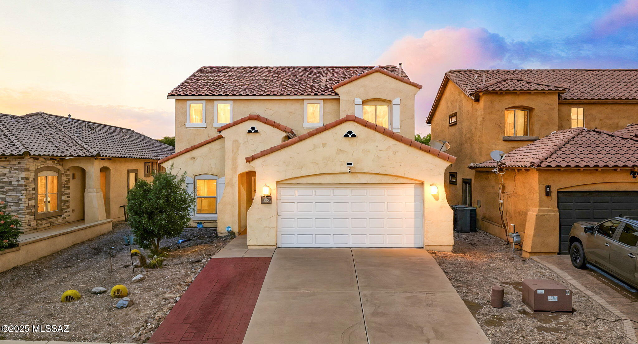 Come see this beautiful 4bd, 3bd, home in the Rancho Sahuarita community, featuring an upstairs loft and a full bedroom and bathroom on the main floor. Interior updates include newer laminate flooring throughout and newer remote-controlled ceiling fans in all rooms. The kitchen offers granite countertops, a newer stainless steel refrigerator, and dishwasher. Samsung front-load washer and dryer are included. A newer water heater has also been installed. Wired for convenience, the home features integrated high-speed internet (hardwired) and is cable/Dish ready in all bedrooms, the living room, and the loft. Ring camera system ready front door unit is hardwired, with two additional solar-powered cameras included.Exterior features include an extended brick paver driveway and a covered patio