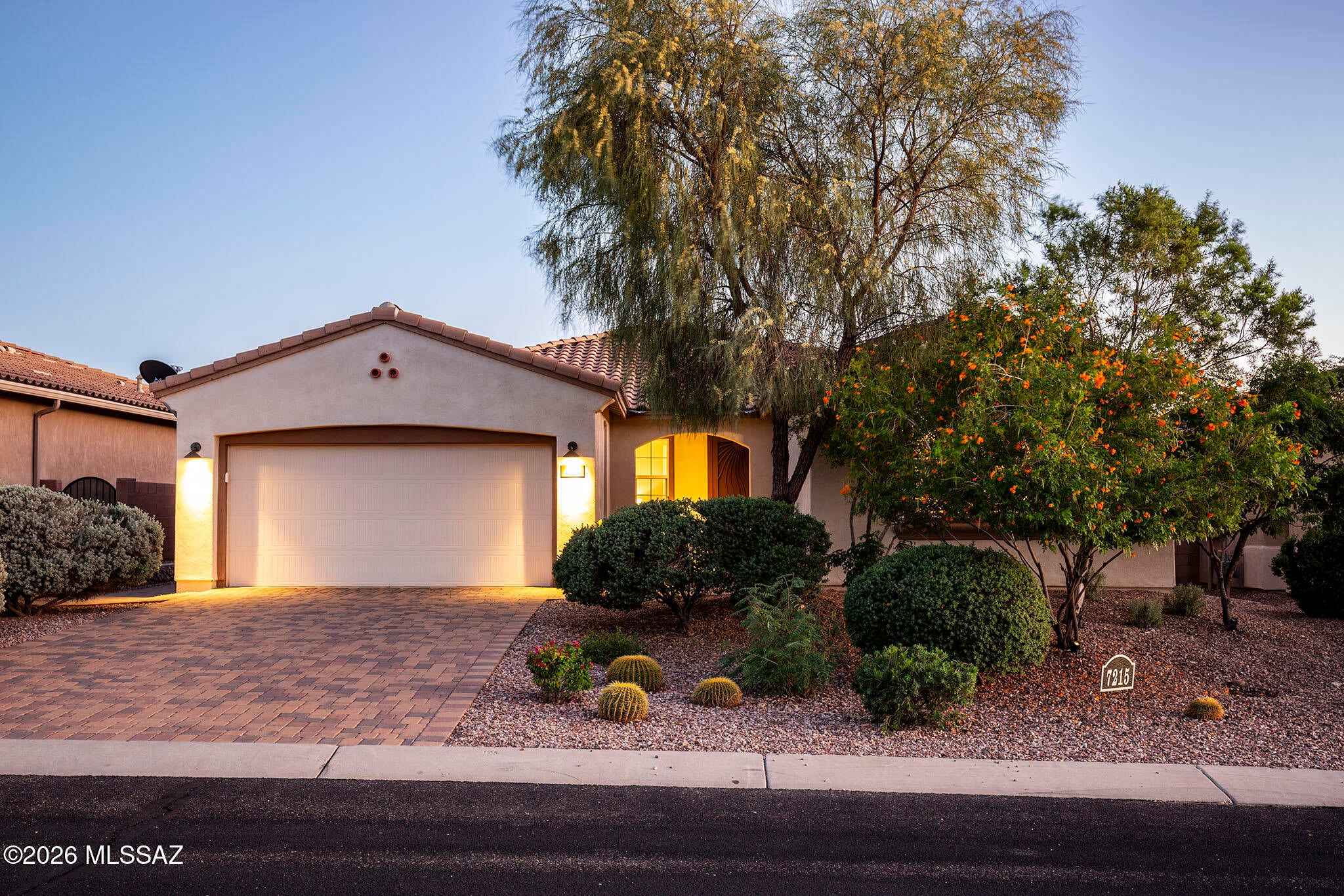 Exceptional value compared with new construction - this move-in ready Mattamy Homes Ridgeview already includes a heated pool, completed landscaping, mountain views and established outdoor living, without the additional expenses and waiting required for closing. Rarely available in gated Golden Barrel at Dove Mountain, this beautifully appointed 2,519 square foot home offers three bedrooms, and 3.5 baths - with each bedroom enjoying its own bath - plus a separate den with double doors, formal dining area and 3-car tandem garage. The split-bedroom Ridgeview design includes a private secondary suite - an unusually versatile arrangement for guests or multigenerational living. The open great room is anchored by a gourmet kitchen featuring staggered maple cabinetry, quartz countertops, a generous island and breakfast bar, tiled backsplash, built-in wall oven and microwave, 5-burner gas cooktop and stainless-steel appliances. The spacious primary suite offers patio access dual vanities, a large walk-in closet and an oversized tiled walk-in shower with spa niche. Outdoor living is equally impressive with a heated pool, dramatic water feature, mountain views, covered patio, professionally installed misting system, remote-controlled sunshades, paver driveway and attractive desert landscaping with citrus trees. Enjoy the natural beauty and lifestyle of Dove Mountain, with nearby hiking and biking trails and renowned golf. A distinctive home offering the bedroom-and-bath flexibility, pool and established outdoor improvements that are difficult to duplicate in this subdivision.