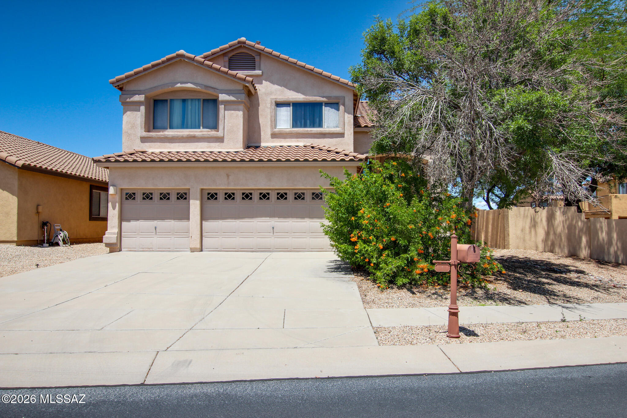 Welcome to this stunning Rancho Sahuarita home where space, natural light, and elegant design come together beautifully. From the moment you enter, soaring ceilings, a grand staircase, and expansive windows create a bright and inviting atmosphere. This spacious home features 3 bedrooms, 2.5 bathrooms, a 3-car garage, and multiple living areas perfect for entertaining, relaxing, or working from home. The kitchen offers granite countertops, ample cabinetry, a breakfast bar, and a cozy dining nook overlooking the backyard. Upstairs, the primary suite includes double-door entry, balcony access, and a versatile flex space ideal for an office, nursery, gym, or sitting area. Enjoy a landscaped backyard and all the amenities Rancho Sahuarita has to offer.