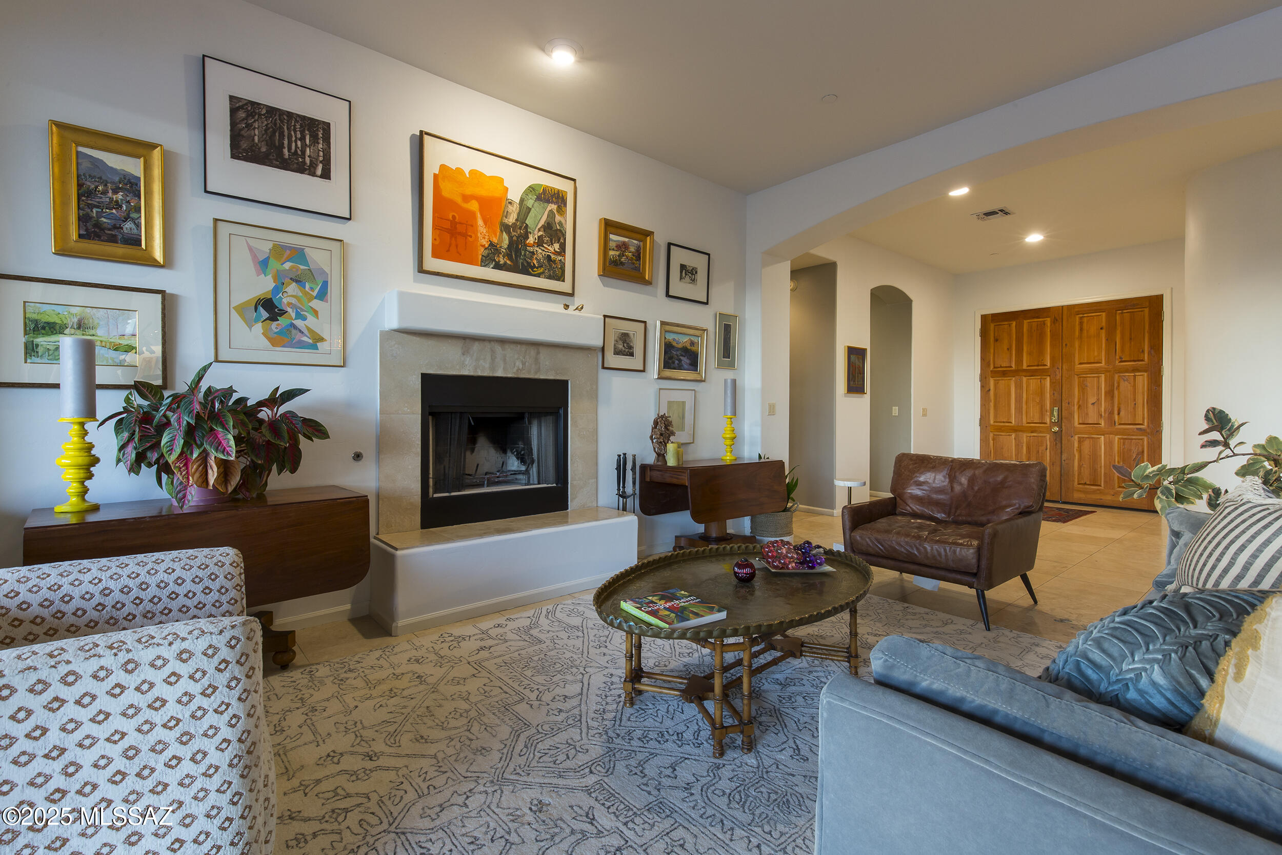 Some homes are nice. This one makes you want to stay.
From the moment you walk through the door, the light, the openness, and the easy flow of the home just feel right. The living room welcomes you with a warm fireplace and large glass doors that open to the backyard, instantly connecting the indoors with the beautiful outdoor spaces beyond.
Step outside and you will understand why this home is so special. The backyard was designed for living well. A sparkling pool anchors the space, while a covered veranda with bar seating creates the perfect place to gather with friends. Just beyond, a sunken conversation area surrounds an outdoor fireplace where evenings naturally turn into long, relaxed nights under the Arizona sky. Inside, the kitchen and great room form the heart of the home. An oversized refrigerator, gas cooktop, granite countertops, and a generous prep island make it easy to cook, entertain, and stay connected with everyone around you.
The home offers 3 bedrooms, 2.5 baths, and a dedicated office, giving you room to work, relax, and host. Built by the original owners with quality in mind, it includes solid core doors, a post tension slab foundation, and a spacious three car garage with EV charging station.
Morning coffee comes with soft desert light thanks to the east facing orientation, and evenings end with spectacular Arizona sunsets across the west.
This is more than a house. It is the kind of place where weekends feel like a getaway and everyday moments become something you look forward to.
With a recent price reduction, it may be the opportunity you have been waiting for.
Come see it in person. Homes like this are meant to be experienced.
