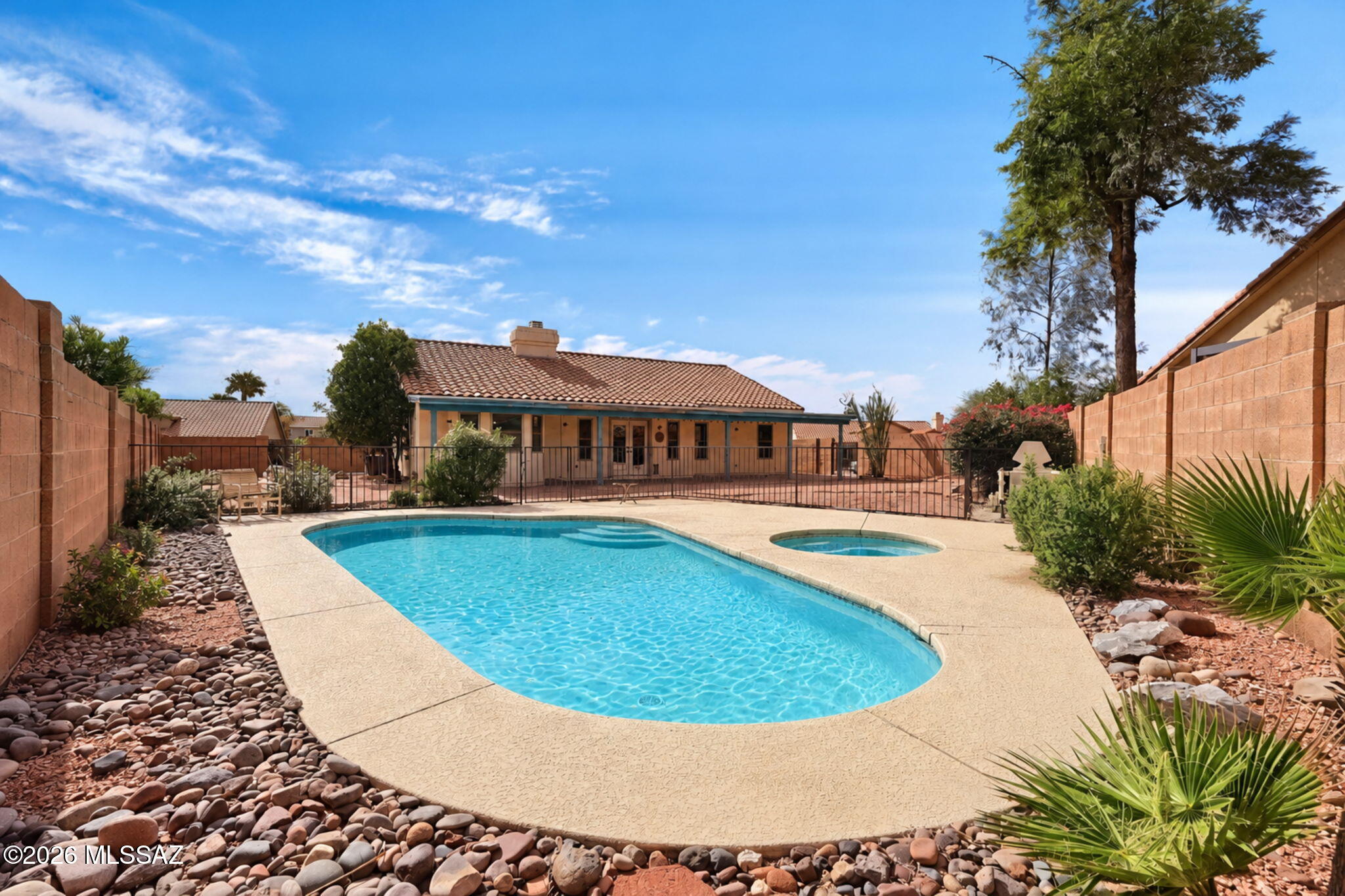 Welcome to Bridlewood Ranch Estates! Discover the charm of NW Tucson living in this inviting 3bd/2ba home w/a versatile den, offering 1,787 square feet of living space on approximately a quarter-acre lot. Enjoy the freedom of NO HOA! The spacious backyard is a true highlight, featuring a private pool & spa, a covered patio & plenty of room to relax or entertain while enjoying the Arizona lifestyle. Inside, the welcoming living area w/fireplace adds warmth & character & updated kitchen with tons of counterspace is great for cooking & entertaining.  2-Car garage provides convenient parking & storage. Home needs some cosmetic work & is being sold in as-is condition. Come see all the possibilities!