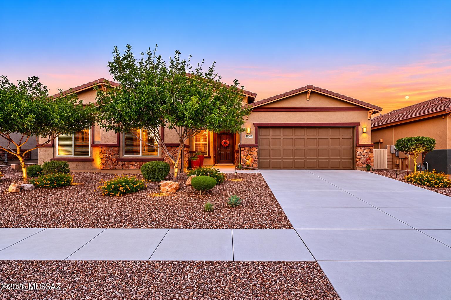 Beautiful 4-bedroom, 3-bath home located in the prestigious gated community of Silverhawke in Oro Valley, nestled in a quiet cul-de-sac. Built in 2019 and impeccably maintained, this home offers a spacious open concept floor plan with modern finishes and abundant natural light. Enjoy stunning mountain and desert views in a peaceful setting. The kitchen flows seamlessly into the living and dining areas, perfect for everyday living and great for entertaining. The private primary suite and well sized secondary bedrooms offer comfort and flexibility. Conveniently located near parks, trails, shopping, dining as well as top-rated schools, this move-in-ready home combines luxury, comfort and Arizona living at its best.