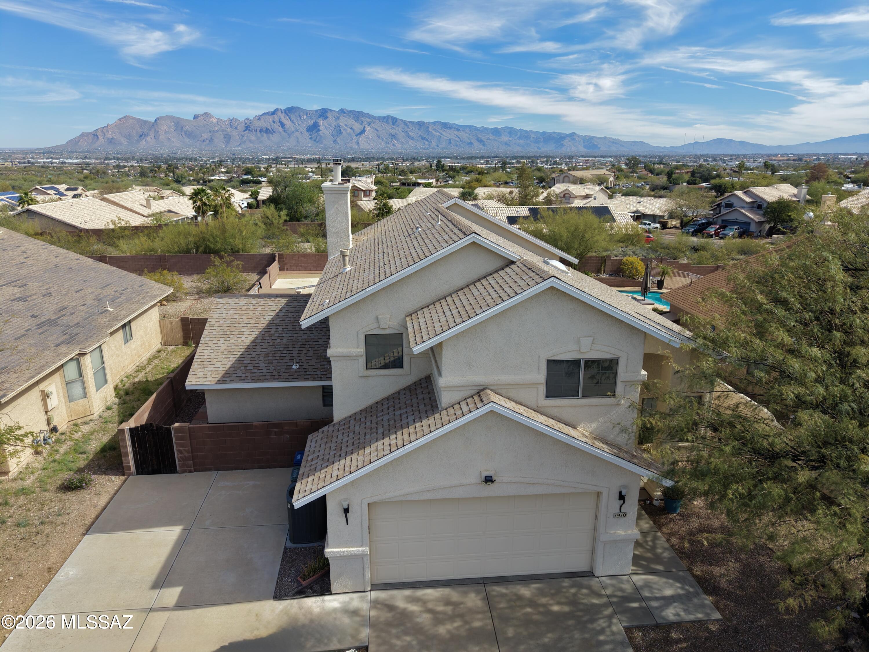 Wake up to mountain views and unwind beside your own private pool at 1910 N Takahe Way. Designed for Arizona living, the backyard features artificial turf, generous patio space, and room to entertain -- all framed by a beautiful mountain backdrop.

The home's flexible layout includes a separate guest quarters with its own bathroom and backyard access, offering privacy and versatility for guests, extended family, or a dedicated office.

A rare combination of views, pool, and flexible living space in a convenient Tucson location. And no HOA!