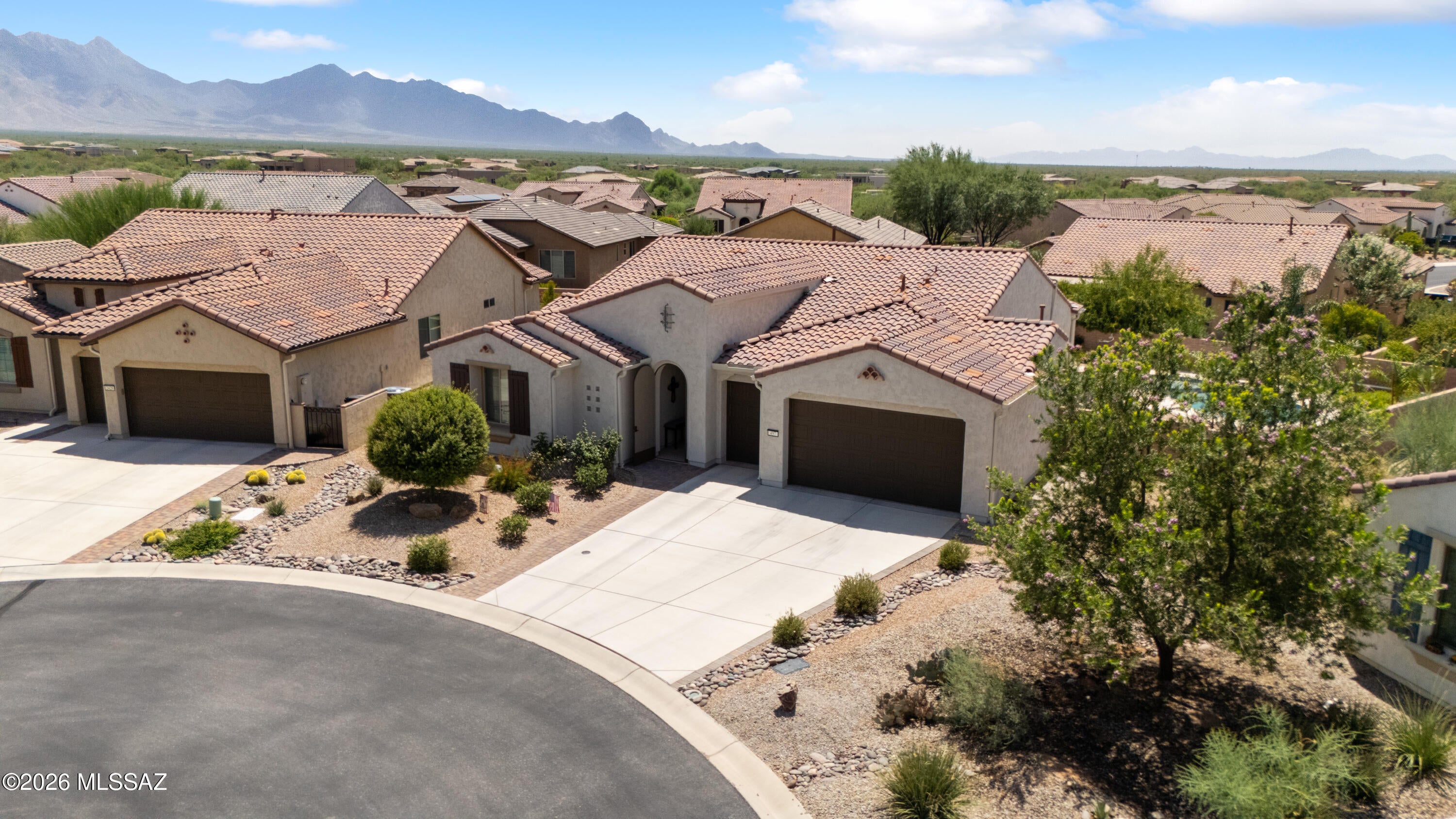 GOLF-COURSE LIVING, GATED COMMUNITY, PRIVATE POOL,  LARGE LOT! Desirable Pavona model in Quail Creek, a premier 55+ community in Northeast Green Valley known for year-round golf and resort-style living. This beautifully designed 2-bedroom home offers an ideal blend of comfort, style, and functionality. The gourmet kitchen features granite countertops, a large island with sink and breakfast bar, butler's pantry, and walk-in food storage pantry--perfect for entertaining and everyday living. A spacious laundry room adds exceptional storage and convenience. The bonus room with French doors provides flexibility as a home office, den, hobby room, or private retreat. Beautiful wood-look tile flows throughout the main living areas, while the spacious living room opens through sliding glass doors to your private backyard oasis. Enjoy a covered patio, pool area, attractive landscaping, and a large lot--perfect for relaxing or entertaining. Located in a security-gated community near golf, this is Arizona living at its best!