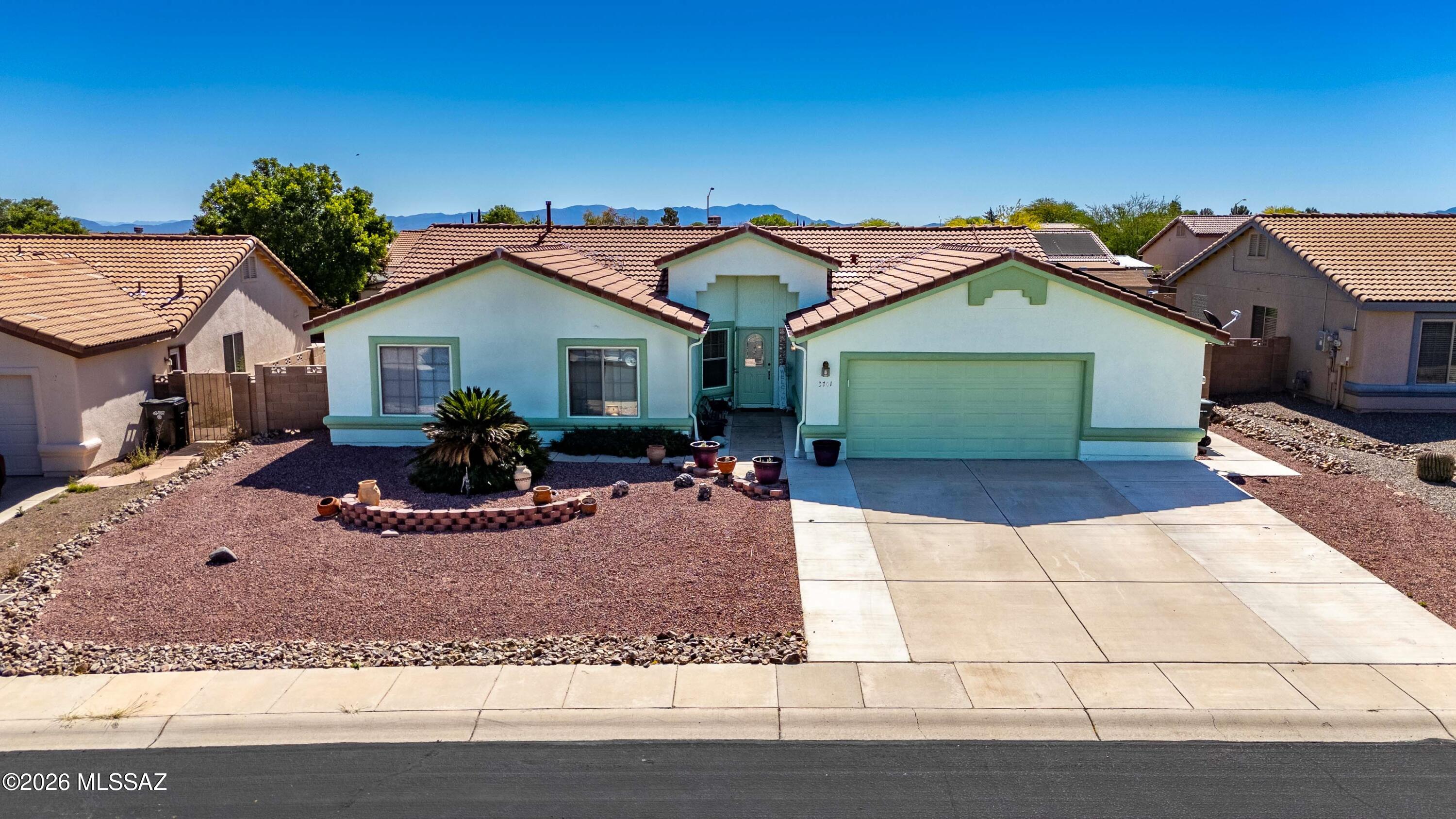 Welcome home to this beautifully updated 4-bedroom, 2-bath residence offering 2,017 sq ft of comfortable living in Sierra Vista. Built by Caliber Homes in 2004, this property blends quality construction with thoughtful upgrades and inviting spaces throughout.
 Step inside to a warm and welcoming living area featuring an elegant archway layout and a cozy gas fireplace--perfect for relaxing evenings or entertaining guests. The kitchen has been tastefully remodeled in 2023 and truly shines with updated cabinetry, granite countertops, a stylish butcher block island, older black appliances, and durable tile flooring--creating a space that's both functional and visually appealing.
 All four bedrooms offer flexibility for a variety of needs, including one currently used as a home office that features tile flooring instead of carpet--ideal for work-from-home convenience or a creative space. The hall bathroom has been upgraded with a brand-new walk-in shower completed in 2024. The primary bathroom offers a separate shower and soaking tub, along with double vanity sinks.
 An Arizona room adds versatile living space--perfect for enjoying morning coffee, cultivating plants, or relaxing year-round in a light-filled setting.
 Step outside to a fully landscaped backyard designed for both enjoyment and ease of maintenance. You'll find a blend of real grass, decorative gravel, garden beds, and even peach trees--creating a peaceful outdoor retreat with room to relax or entertain.
 Adding even more value, the home includes a solar system designed to offset all electrical needs, with the option to have it paid off at close of escrow with an acceptable offer--helping you enjoy long-term energy savings from day one.
 If you're looking for a well-maintained, upgraded home with charm, efficiency, and outdoor appeal, this one is a must-see!