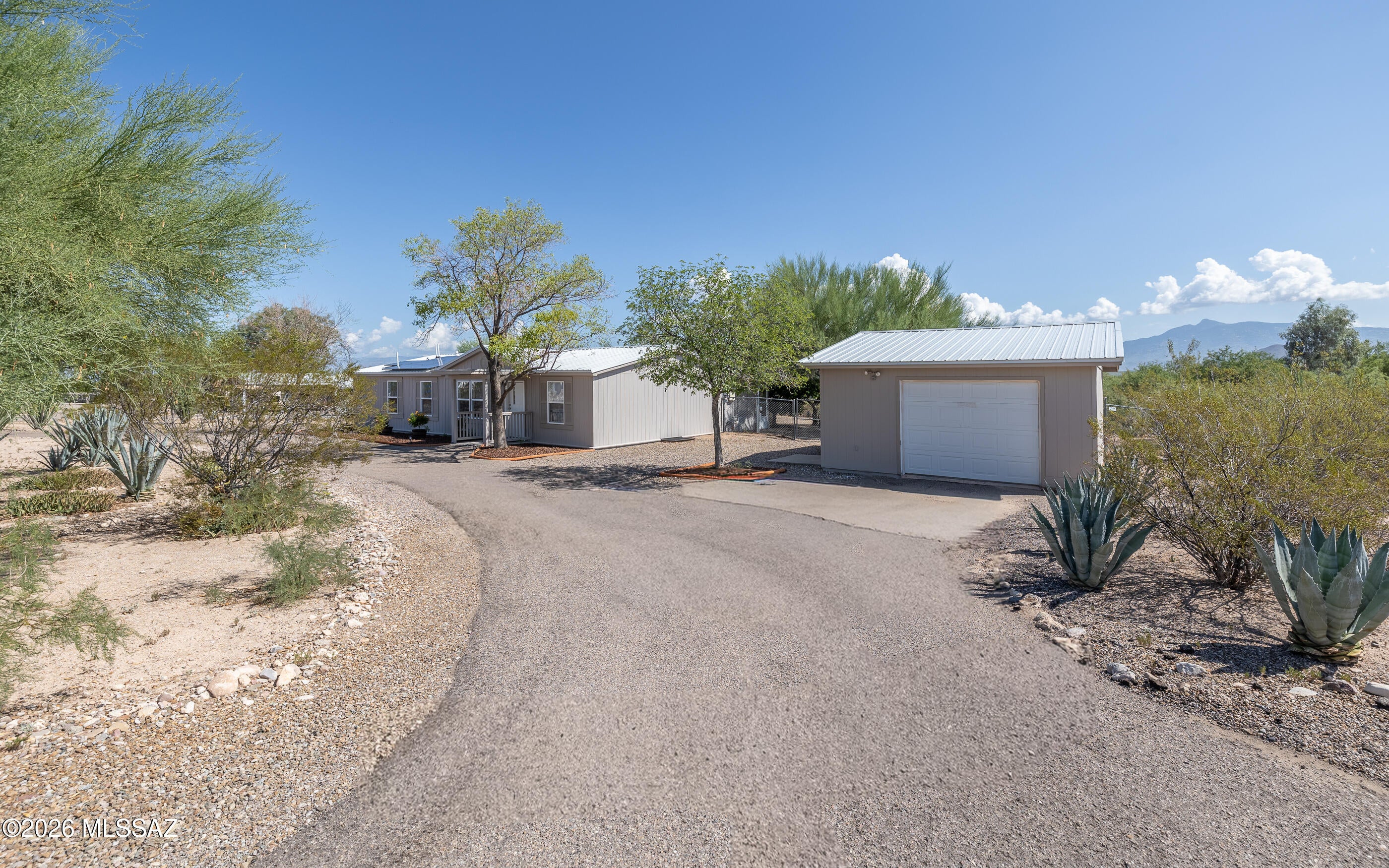 Beautifully Remodeled Home in the Vail School District! This charming 3-bedroom, 2-bathroom home sits on a private corner lot with paved streets and is conveniently located just 1 mile from I-10 for an easy commute. The home features extensive updates, including a new steel roof, new windows, new plumbing, and an updated HVAC system. Enjoy the Arizona lifestyle in the spacious Arizona room, perfect for relaxing or entertaining. The property also offers solar power, a detached garage, space for RV storage and a fully fenced yard. A great combination of modern updates, privacy, and convenience--this home is move-in ready and a must-see!