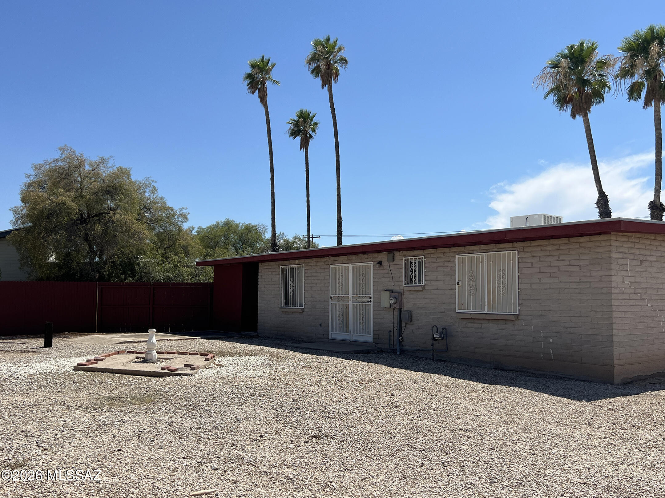 Charming, vintage, well-maintained 3 bedroom, 2 bathroom house sits back off the street on a Cul-de-sac.  Conveniently located near Davis Monthan Air Force Base, schools, transportation, shopping and restaurants.  Large, enclosed backyard. No HOA. No Carpet. Extra storage space available in carport.  A true gem in the heart of Tucson.  A must see!