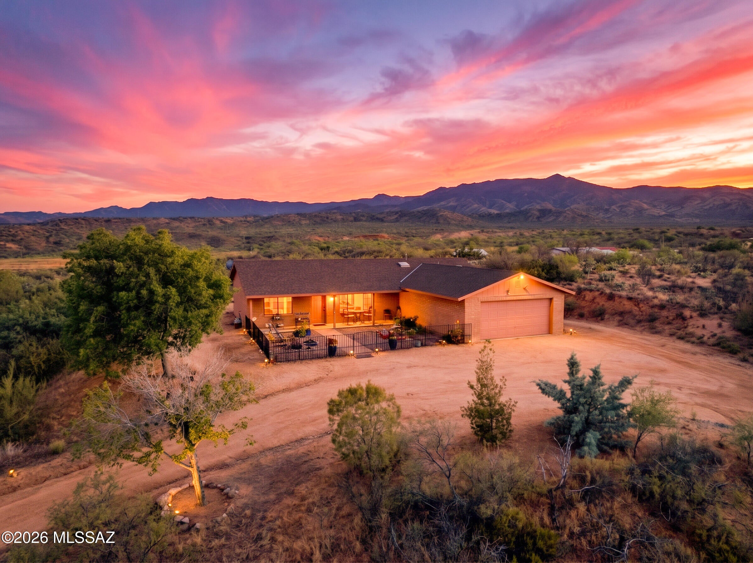 This block home on 5.02 acres of fully-fenced horse property is the perfect opportunity to enjoy rural living in the peaceful town of Oracle! Take in the panoramic mountain views and the variety of wildlife from the large covered porches and other outdoor seating areas. Horse-ready, with a shaded corral and shed for hay/tack. The spacious kitchen features stainless steel appliances and a skylight. The attached two-car garage provides protection for your vehicles or toys, and the laundry room has extra room for storage. This one-owner, superb quality Soule-built home has been well maintained and well loved!