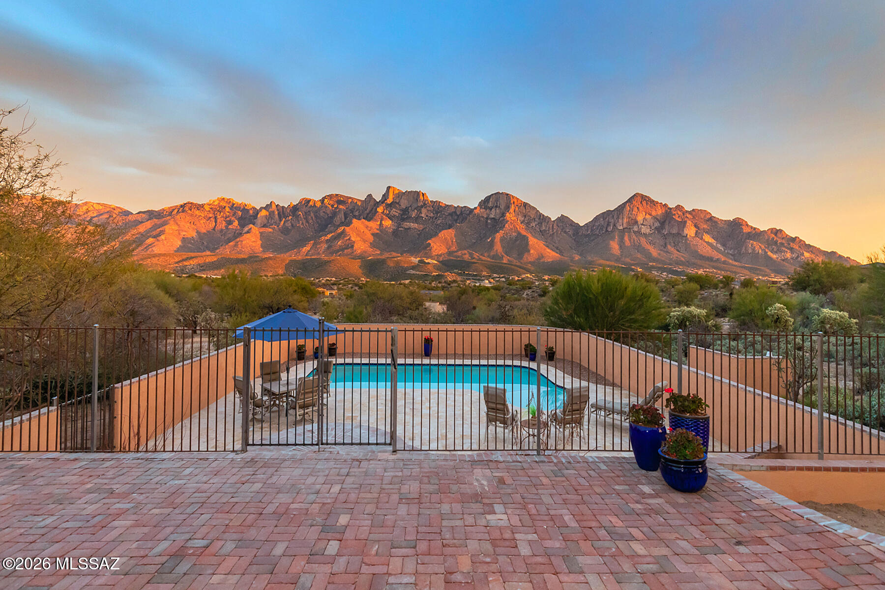 Experience the Views firsthand to get the feeling of the Mountains in your backyard as the pictures, as good as they are, still don't do the view justice! It is Magnificent! Luxury home on 2.5 acres in the heart of Oro Valley! Stunning Mountain Views, Heated Pool, Private Patios, Custom Mesquite Kitchen, Luxury Primary Bath w/Copper Tub, Old Work Rustic Vanity w/Jaisalmer Countertops, Massive Multi-head Spa Shower, 3 Bd/2Ba ea. w/its own characteristics, Fireplace in LR & Bd, Glass Walled LR & 1 BD w/spectacular Mountain Views. extensive Outdoor Living Space w/multiple Covered & Open Patios, Private Drive, within minutes of Hiking, Horseback riding, Biking & Shopping. Even room for your own horses! Truly one of a kind! Come experience Oro Valley Luxury at its finest!