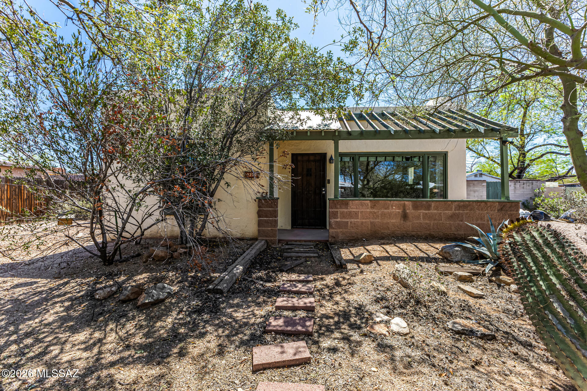 Enjoy easy living in this 2-bed, 1-bath home offering comfort and convenience! Surrounded by mature trees that provide refreshing shade, this gem welcomes you with a cozy front patio, perfect for peaceful mornings or relaxing afternoons. Come inside to find an inviting living room featuring exposed ceiling beams, Saltillo tile flooring, and a fireplace that will keep you toasty warm during the cooler months. Adjacent to it is the dining area, ideal for hosting dinner parties. In the kitchen, you'll have matching appliances, recessed lighting, white cabinets, and granite counters. Sizable family room beckons you to unwind after a busy day. Each bedroom promises restful nights! Don't miss the spacious backyard equipped with paver seating areas. Hurry! A deal like this won't last!