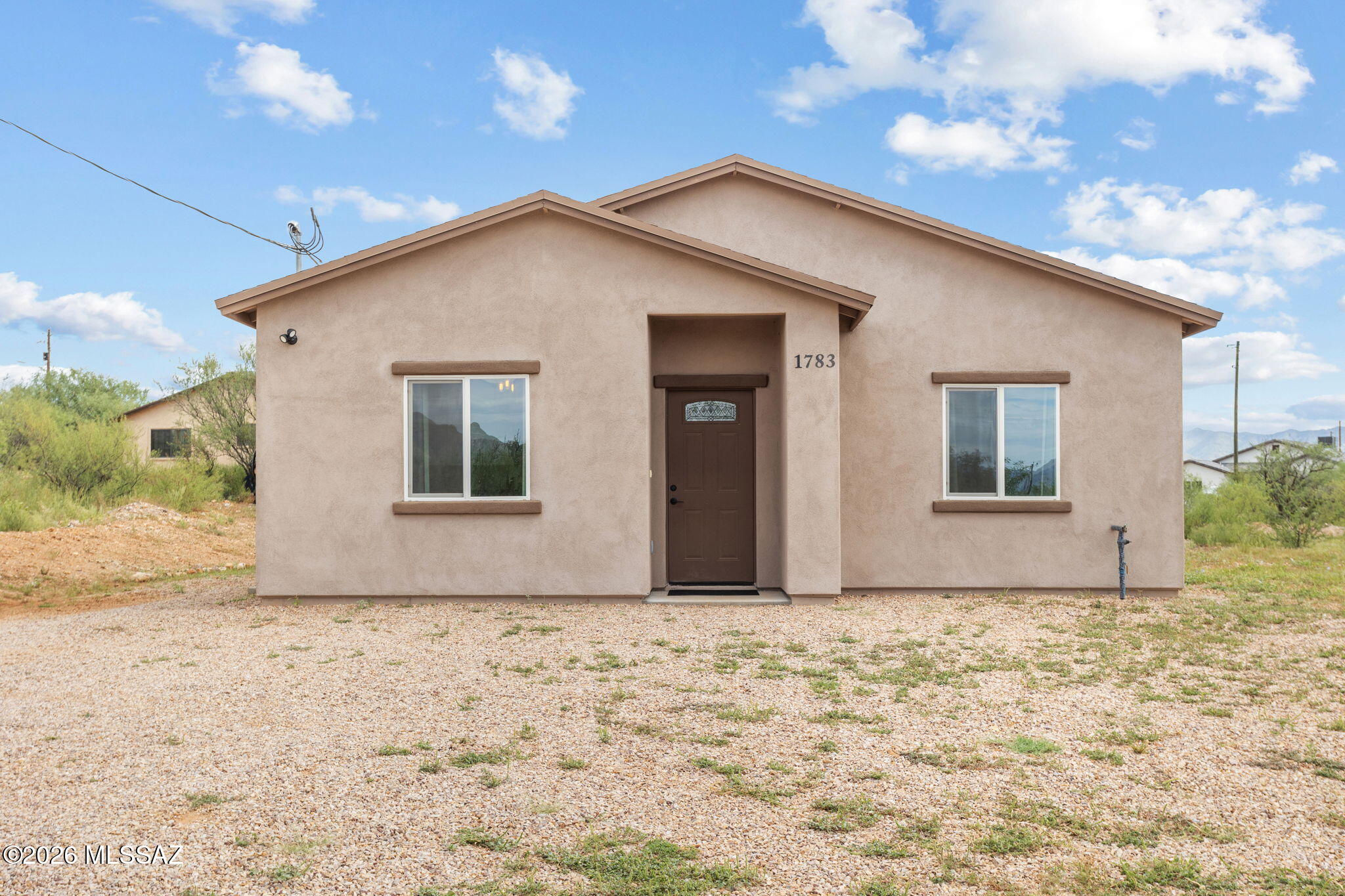 Beautiful Mountain Views & Serene Rio Rico Living! Welcome to this newer 3 bedroom, 2 bath home built in 2023, offering modern comfort in a peaceful Arizona setting. The home features ceramic tile flooring throughout, a spacious kitchen with granite countertops, stainless steel appliances, generous cabinetry, and ample storage. Enjoy the quietness and natural beauty of Rio Rico, surrounded by beautiful mountain views, open desert landscapes, stunning sunsets, and peaceful skies. 

The flat 1/4 acre lot offers plenty of usable space for outdoor living, landscaping, additional parking, and future improvements, with potential to add a carport or garage, and no HOA!

A wonderful opportunity to enjoy a newer home, beautiful scenery, and the relaxed lifestyle Rio Rico has to offer.