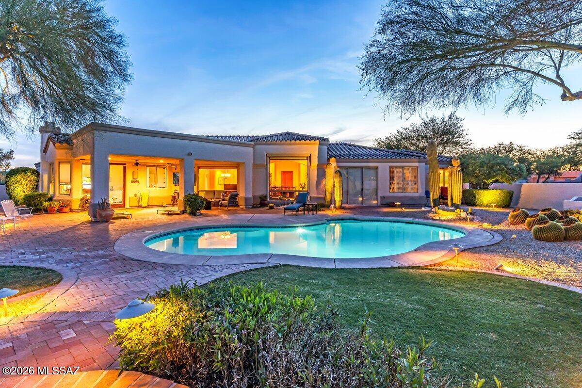 Located in the desirable Logan's Crossing community, this beautifully maintained home offers space, privacy, and sweeping mountain views on just under an acre, creating a peaceful setting that fully embraces Tucson's outdoor lifestyle. 

Inside, the thoughtful layout includes three bedrooms plus a dedicated office (easily a fourth bedroom) and 2.5 baths, offering flexibility for work-from-home living or guest accommodations. Two separate living areas provide comfortable spaces for both everyday living and entertaining, with natural light and views connecting the interior to the surrounding landscape.

The resort-style backyard features unobstructed mountain views, water feature, and a sparkling pool, providing an ideal backdrop for relaxing afternoons, weekend gatherings, and quiet desert evenings.  The covered patio and pavers are perfectly equipped with a built-in bbq, outdoor refrigerator for convenience, and elevated patio beyond the pool for soaking in the Sonoran sunsets. 

The primary suite serves as a private retreat, including a large walk-in closet and a spa-like bathroom, equipped with dual sinks and leather-finished granite countertops. Generous proportions throughout the home create a comfortable, livable flow designed for both function and ease.

Ideally positioned with quick access to The Loop, and just minutes from nearby parks, restaurants, and everyday amenities, this property offers a rare combination of space, views, and convenience in one of Tucson's most accessible locations.