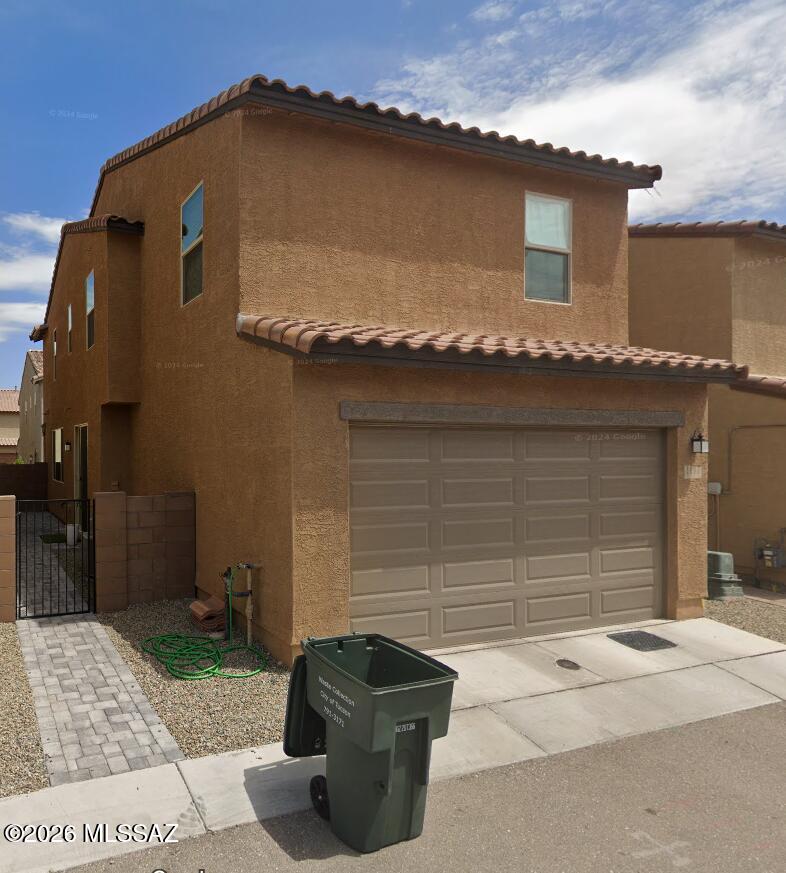 Welcome to this beautiful 4-bedroom, 2.5-bath home located in the vibrant city of Tucson, AZ. This two-story home boasts a spacious layout with a 2-car garage for your convenience. The kitchen is a chef's dream, equipped with modern stainless steel appliances, a breakfast bar for casual dining, and a generous walk-in pantry for all your storage needs. The home's location is a major plus, being in close proximity to the University of Arizona, downtown, and a variety of shopping centers. The property also features a fenced side yard, providing a secure outdoor space for your enjoyment. This home is a perfect blend of comfort, style, and convenience. Don't miss out on this gem in the heart of Tucson! Only small dogs permitted. W/D for convenience only.