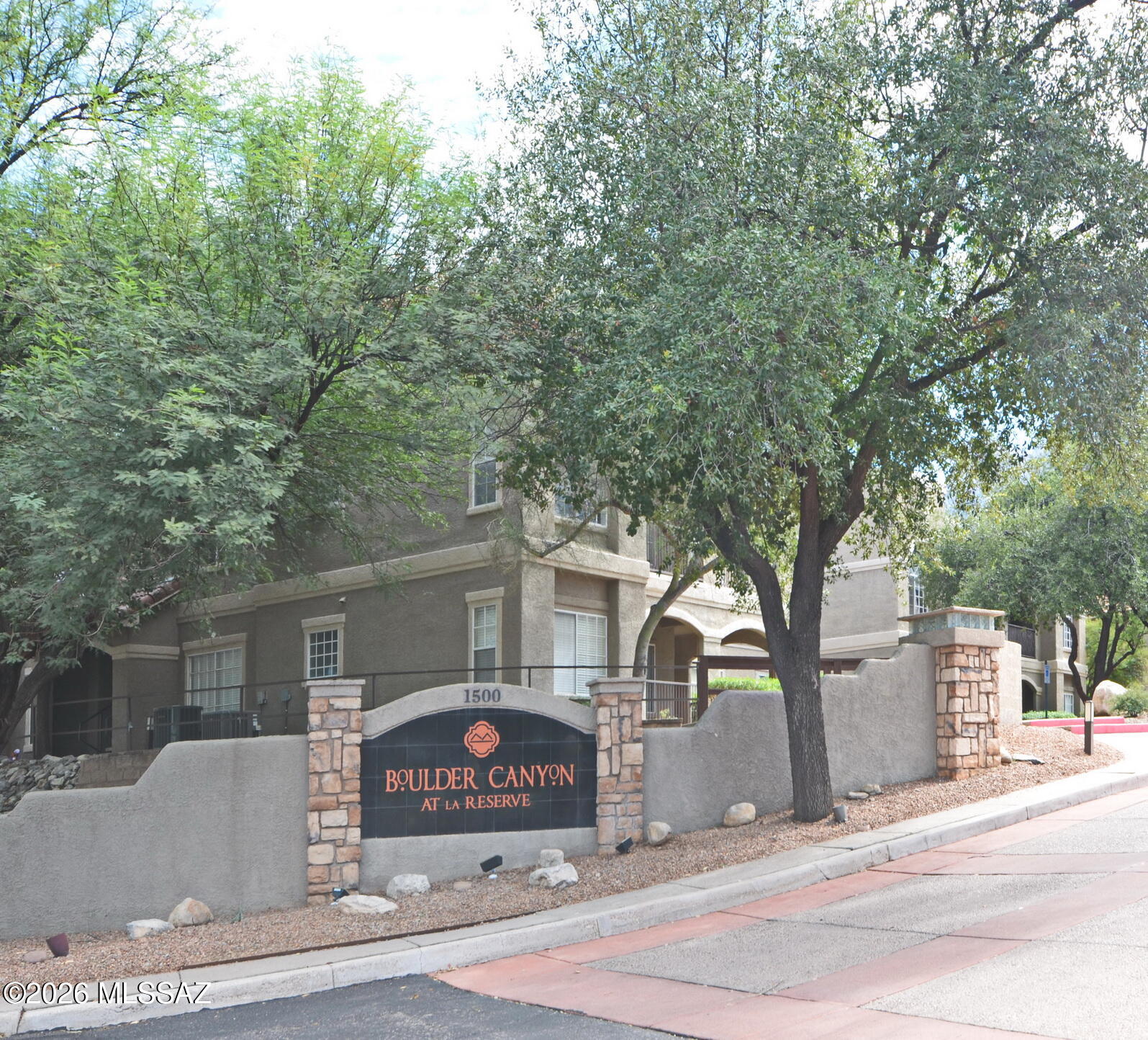 Enjoy resort-style living and beautiful desert surroundings in this charming downstairs condo located in the desirable Boulders at La Reserve community in Oro Valley. This 929 sq. ft. home features 2 bedrooms and 1 bathroom with a comfortable and functional floor plan. The kitchen features quartz countertops, stainless steel appliances, and a separate dining area perfect for everyday meals or entertaining. For added convenience, the unit includes an in-unit washer and dryer as well as a newer AC unit, which was installed in Nov 2024.
Step outside to the covered patio and take in beautiful views of the surrounding desert landscape--an ideal setting for relaxing and enjoying Arizona living. The Boulders at La Reserve offers an impressive selection of community amenities, including a heated swimming pool, spa/hot tub, fitness center, clubhouse, outdoor grills, jogging and walking paths, and assigned covered parking.