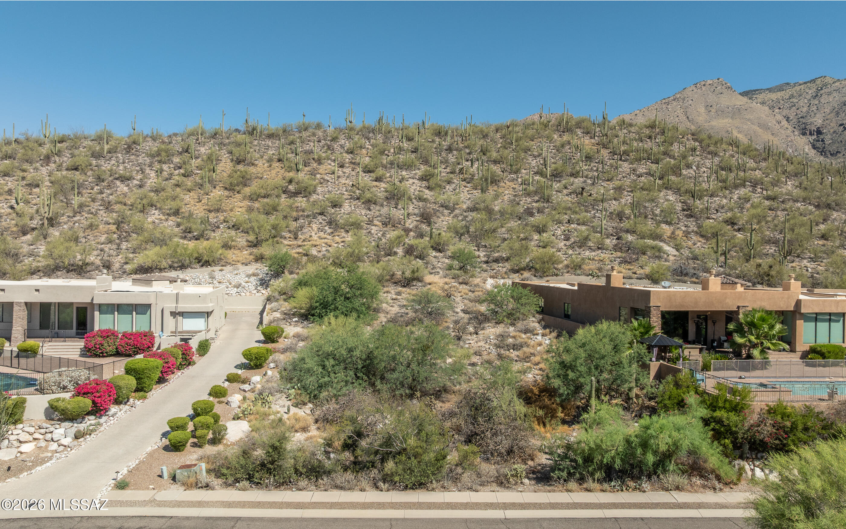 A rare opportunity to own a lovely custom lot in The Foothills - Alta Vista area. Surrounded by beautiful luxury homes - backs to a saguaro studded hillside. Easy access to build. Lovely views. Utilities available. Beautiful natural desert landscape. Catalina Foothills School District. Location is ideal - close to endless dining opportunities and shopping. Great location to build your next luxury custom home.