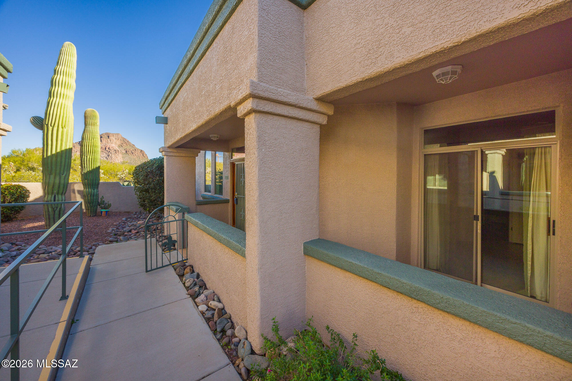 AMAZING townhome/condo in Kinney Village now available. you can explore the Tucson mountains with lots of hiking trails yet close to amenities, What a great place to entertain  with community pool, spa and BBQ area. When you first walk into this WOW home with 2bedroms 2 baths and den the openness with its 14 foot ceilings will impress you. let alone the features of elegant curved archways & windows. and great kitchen with picture perfect windows that have GREAT views.     This home has fully tiled floors with tiled walk in primary shower, storage abound from pantry to extra closet space,   YOU deserve the best, and very well priced, A must see this lovely home wont last long.