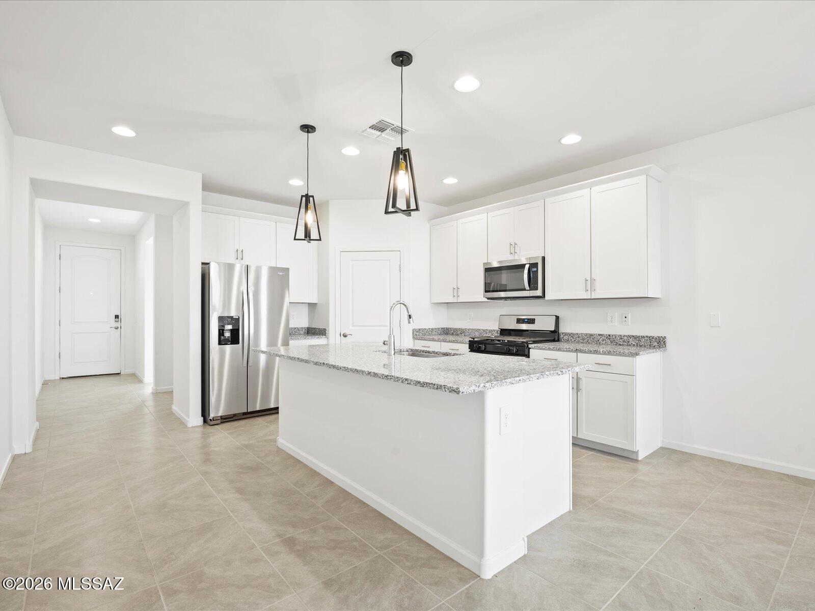 Welcome home to this spacious 4-bedroom, 3-bath residence designed for the way you live today. A versatile teen room offers the perfect space for homework, movie nights, gaming, or a second living area. The private primary suite features dual sinks and a generous walk-in closet, creating a relaxing retreat at the end of the day.

Located in Sunset Crest at Ajo & Kinney, you'll enjoy a peaceful desert setting with amenities that bring neighbors together, including a playground, picnic areas, and shaded ramadas. Built with innovative energy-efficient features, this home delivers exceptional comfort, healthier living, and savings you can appreciate year-round. Don't miss your chance to own a beautiful new home in one of Tucson's newest communities!