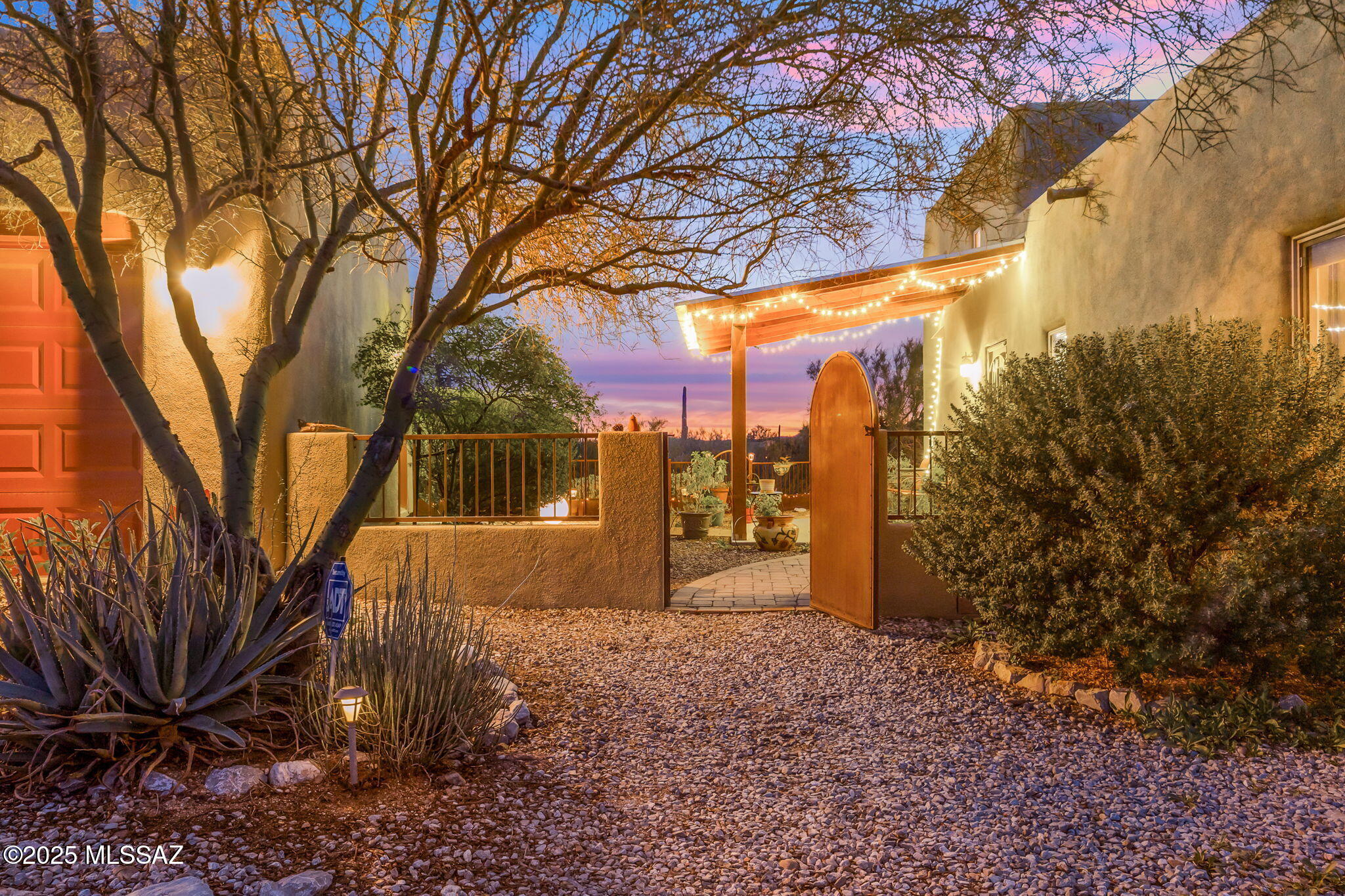 Mountain Views with Amazing Sunsets, surround by a Serene Ambiance of Natural Beauty of the Sonoran Desert. Pristine Custom Built Santa Fe Style Home is Nestled on 3.3 acres, embrace the tranquility of desert living while envisioning the potential this unique property holds. This spacious open floor plan is warm and functional, 3 bedrooms, 2 full bathrooms, filled with natural light. RV parking with custom build RV shade cover, electric, water, sewer line to septic. Seller has planted Orange, Lime, Lemon, Apple, Grapefruit and Peach trees that are thriving. Look for the Features Write Up in the Documents for all the wonderful things this property offers.