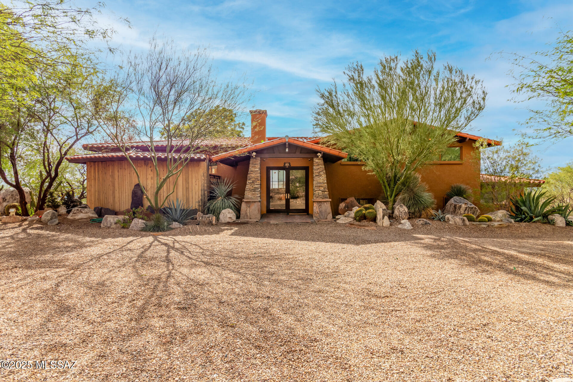 Welcome to Coronado Foothills Estates, where desert beauty meets elevated living. Perched in one of Tucson's most desirable neighborhoods, this remarkable home captures breathtaking mountain vistas from the front and panoramic city views from rear.

With five bedrooms and four bathrooms, including an attached guest suite, this residence offers both space and versatility. The chef's kitchen is a true centerpiece, featuring two full-size sinks, a bar style prep sink, a brand new GE dishwasher, a Thermador Professional Gas Range, Granite countertops, dual islands, a detachable rolling island for added convenience, and more! Enjoy two stunning decks: a north-facing sun deck for mountain views and a south-facing terrace stretching the full length of the home, perfect for soaking in the Tucson skyline and iconic "A" Mountain sunsets.

The top floor hosts the primary suite and an additional bedroom and bath, while the lower level offers two more bedrooms, a bathroom, a multipurpose space, and a dedicated laundry room. The guest suite has private access from the west side of the backyard, ideal for visitors or multi-generational living.

Step outside into a lush desert oasis featuring an exercise pool, hot tub, chicken coop, turtle pond, and a cozy outdoor fireplace, This is an entertainer's dream setting for every occasion.

Don't miss this rare opportunity to own a truly unique Tucson property with some of the most captivating views the city has to offer.