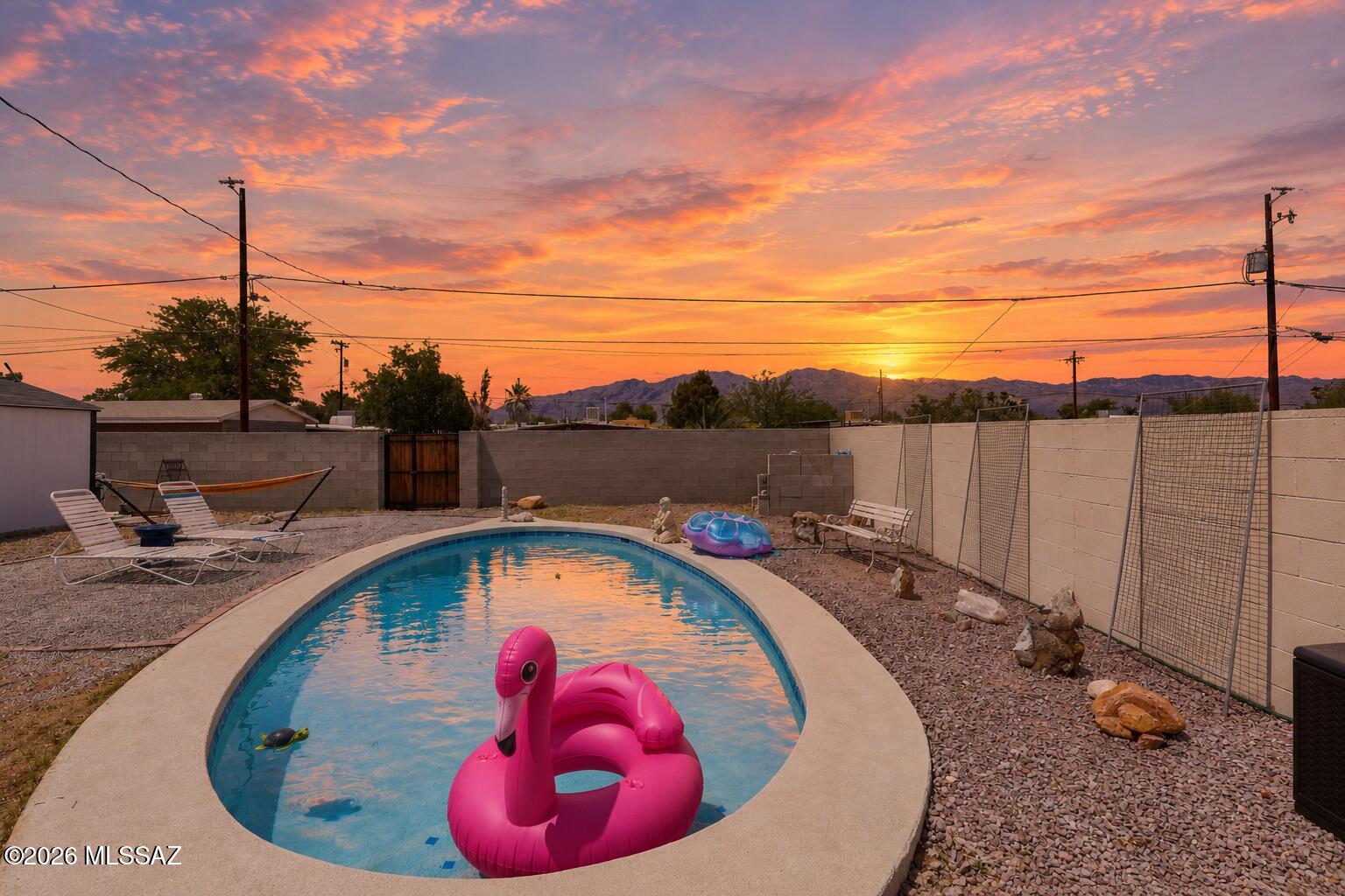 NO HOA! Offering up to $2,500 in buyer concessions toward closing costs or an interest rate buydown. Prime Tucson location! This fully renovated, move-in-ready 4 bedroom, 3 bathroom home with a private pool offers the perfect blend of modern updates and versatile living. Upgrades include New Plumbing (3 yrs), HVAC (4 yrs), Roof (3 yrs), Water Heater (4 yrs), new flooring, stainless steel appliances, granite countertops, LED lighting, a water softener system, and beautifully remodeled bathrooms with LED mirrors. The split floor plan can easily be converted into a private studio, mother-in-law suite, or next-gen living space. The primary, second, and fourth bedrooms each feature private access to the backyard. Long driveway for parking. The backyard offers multiple patio areas with new pavers, a large storage shed, peach & lemon trees, grass, and beautiful mountain views. Located on a quiet cul-de-sac and a short walk to the neighborhood park. Minutes from shopping centers, grocery stores, and restaurants. A fantastic opportunity for families, investors, or anyone seeking flexible living space and a backyard designed for entertaining, with potential for Airbnb. Ideal for multi-generational living or a private guest suite. This is a must-see and won't last long! 
**This home qualifies for a zero down payment program through our preferred lender. Restrictions apply. Contact the listing agent for details.