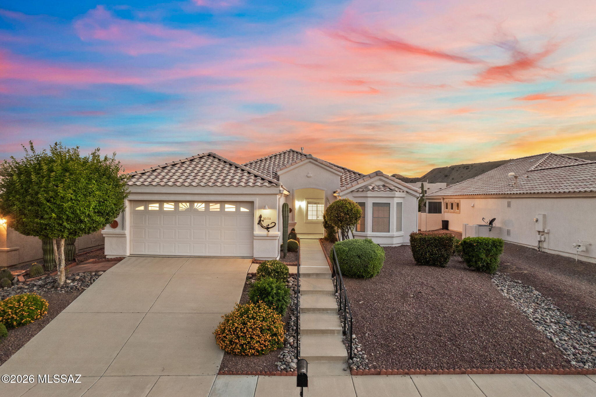 Range Priced-Seller will accept/or counter offers b/w $295,000 & $329,000. Enjoy sweeping mountain and sunset views from this warm and inviting 2-Bed, 2-Bath home with a Den and an enclosed AZ sunroom for effortless year-round living. The bright layout opens to a beautifully landscaped, private backyard, perfect for quiet mornings or evening relaxation. The primary suite offers dual vanities & a walk-in Jacuzzi tub for spa-style comfort, and the oversized garage provides extra storage and workspace. Located in a desirable 55+ community and part of Green Valley Recreation, you'll enjoy access to pools, fitness centers, clubs, classes, and a vibrant social lifestyle. A comfortable desert retreat with the amenities and views that make Green Valley so special. Visit today & fall in love! Green Valley, Arizona, located just 20 miles south of Tucson, is renowned as a premier, active adult retirement community. It borders the Santa Rita Mountains, making it a world-famous hotspot for hiking and birding (especially in Madera Canyon).

Green Valley is anchored by Green Valley Recreation (GVR) which grants residents access to 13 modern, recreation facilities. Members enjoy access to 13 heated swimming pools, 6 state-of-the-art fitness centers, tennis and pickleball courts, and more than 10 specialized hobby and arts studios.